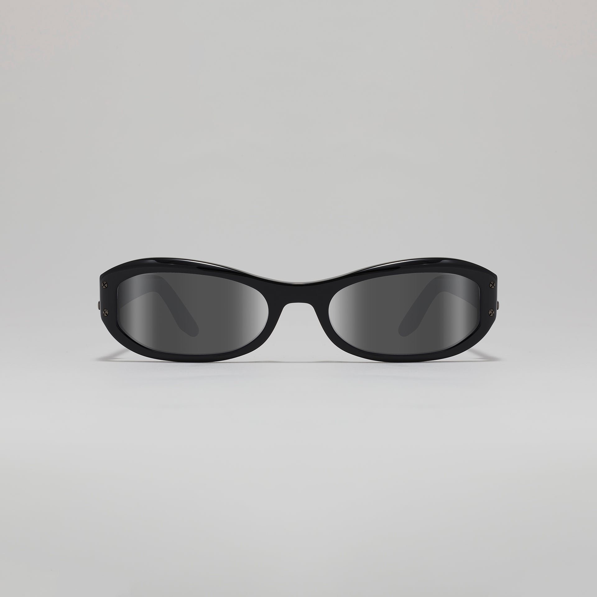 Black sunglasses on a light gray background