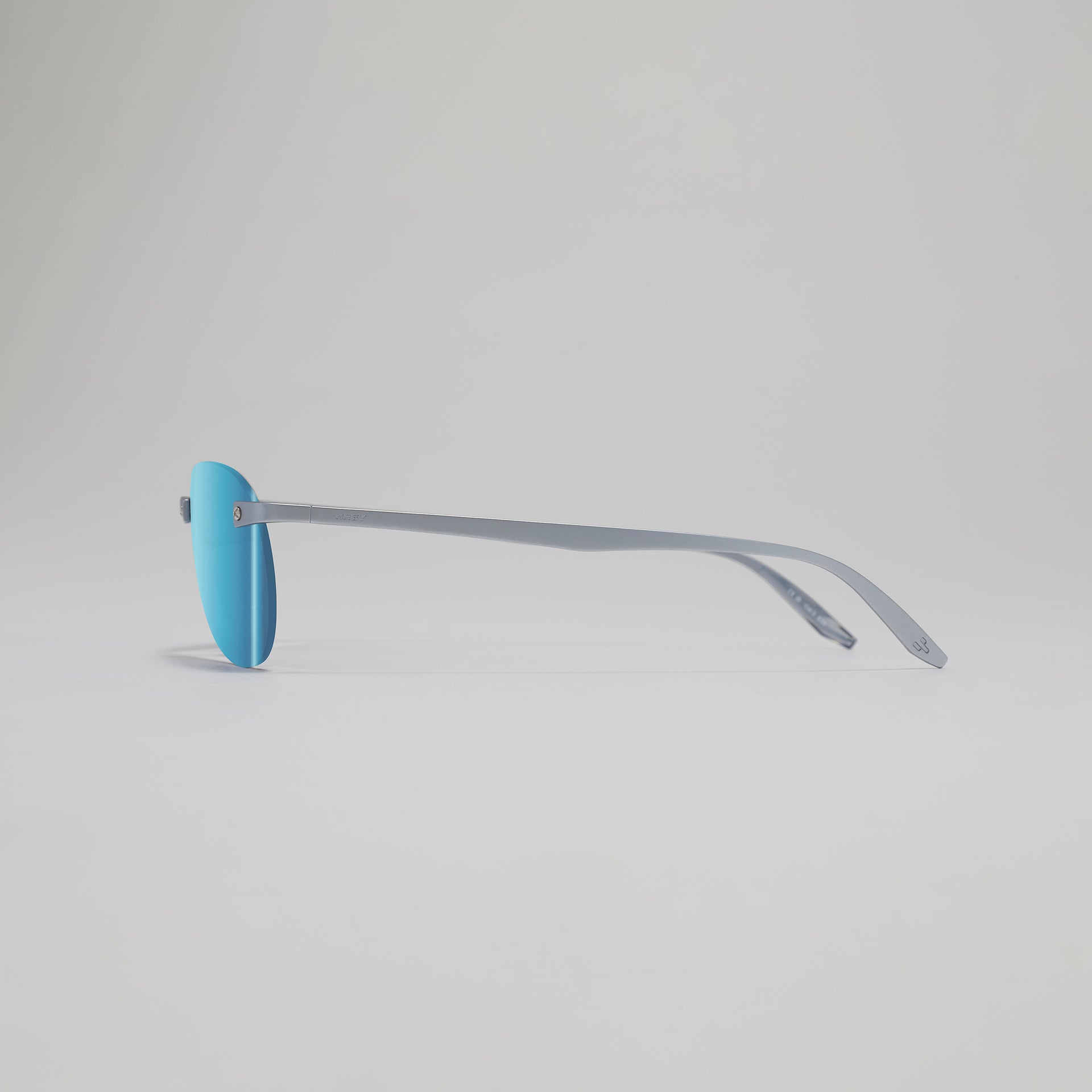 Blue eyeglasses on a light gray background