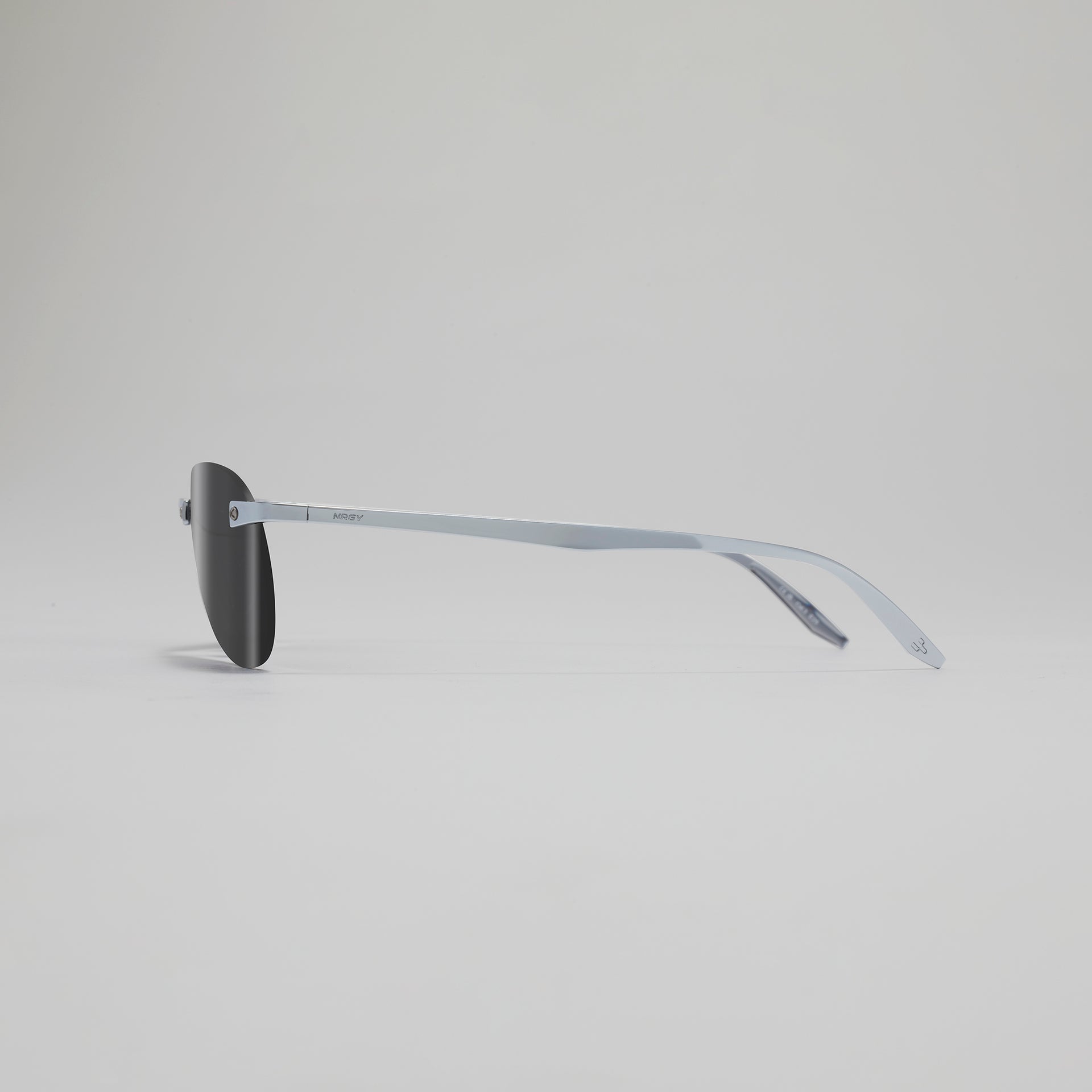 Sunglasses with a thin frame on a light gray background