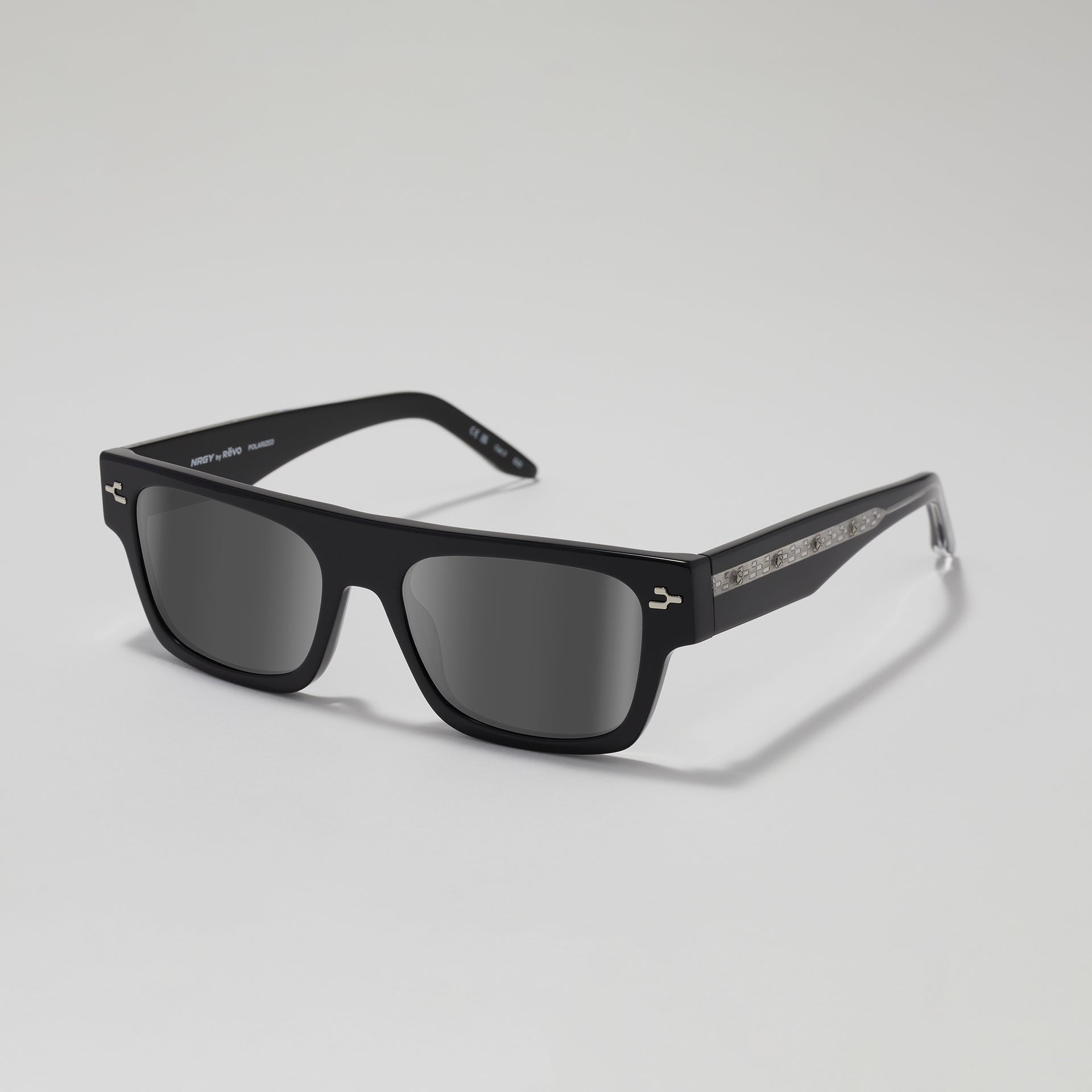 Black sunglasses with a reflective surface on a gray background