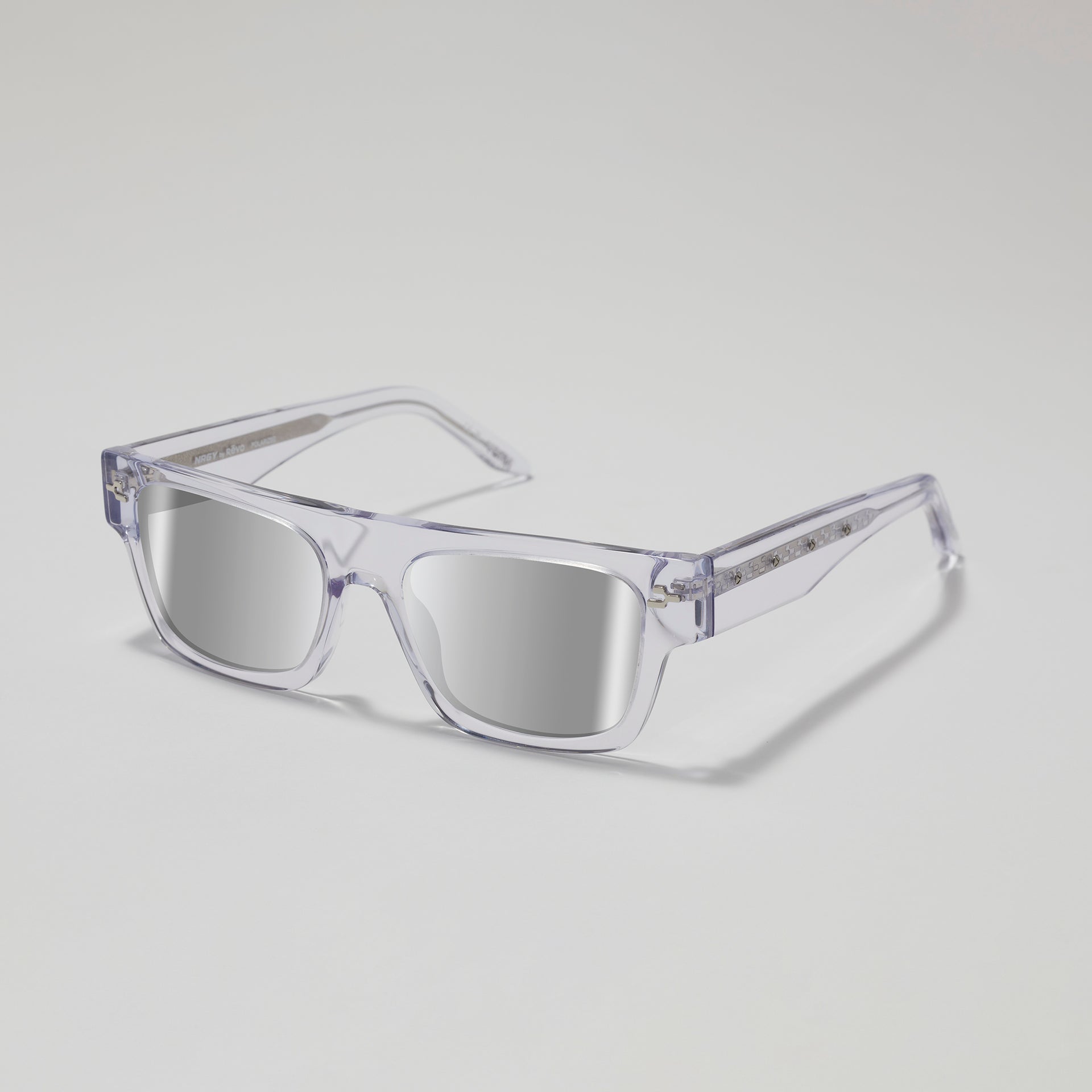 Clear sunglasses with reflective lenses on a light gray background
