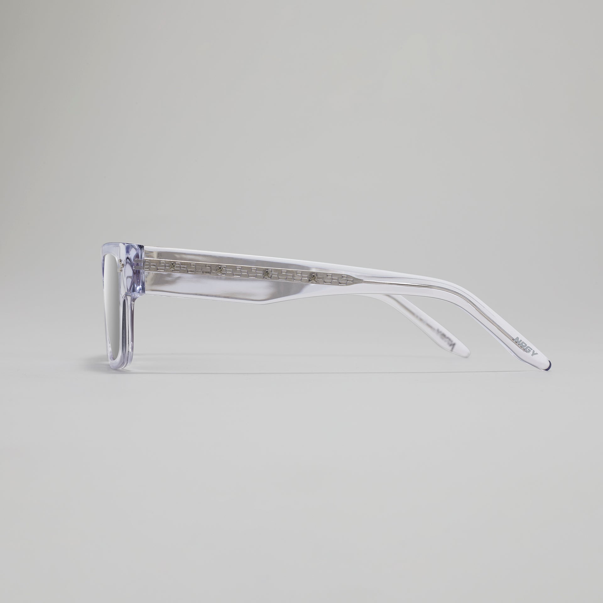 Clear eyeglasses on a light gray background