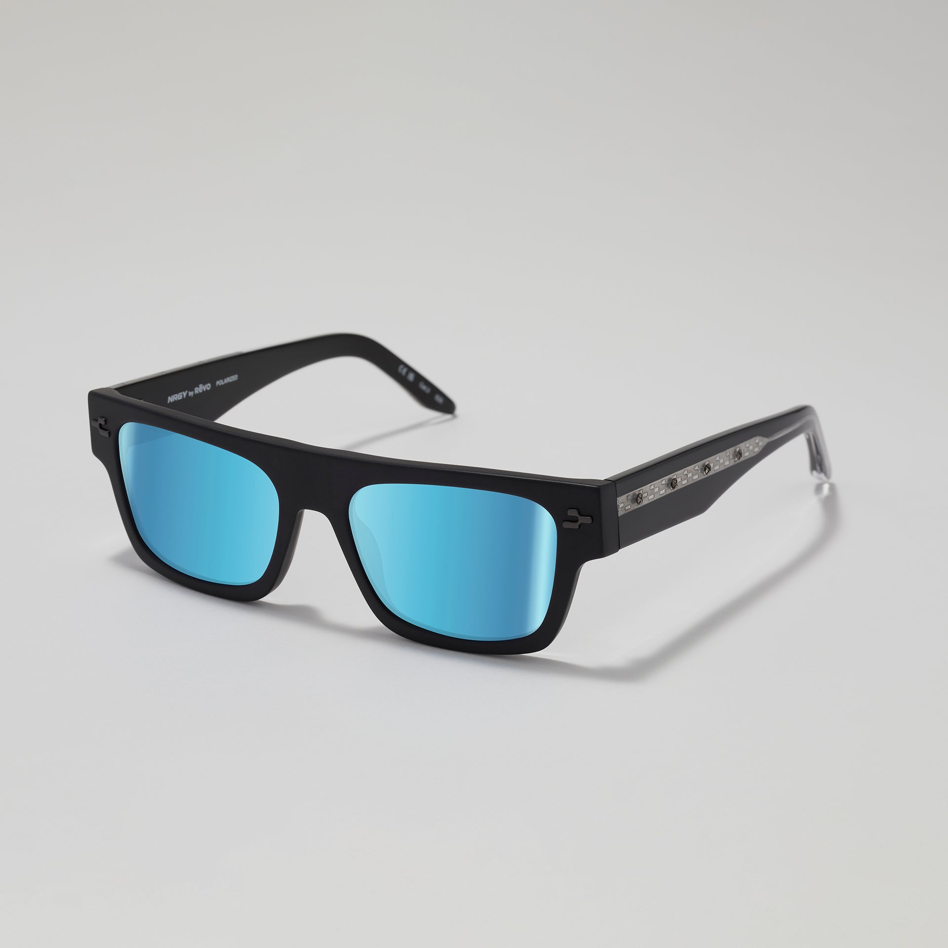 Black sunglasses with blue lenses on a gray background