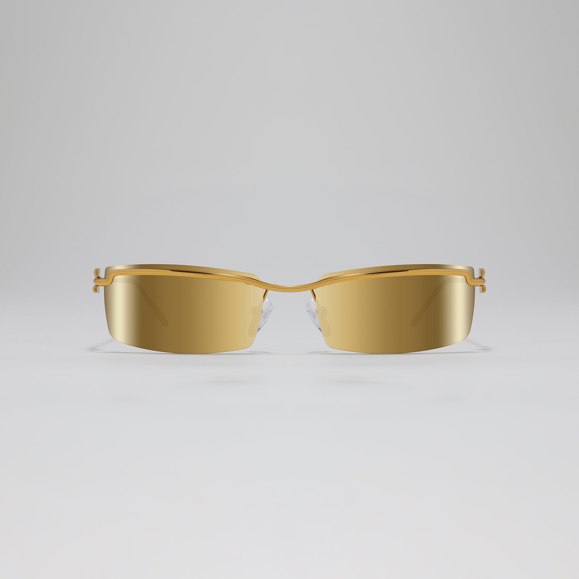 Gold sunglasses on a light gray background