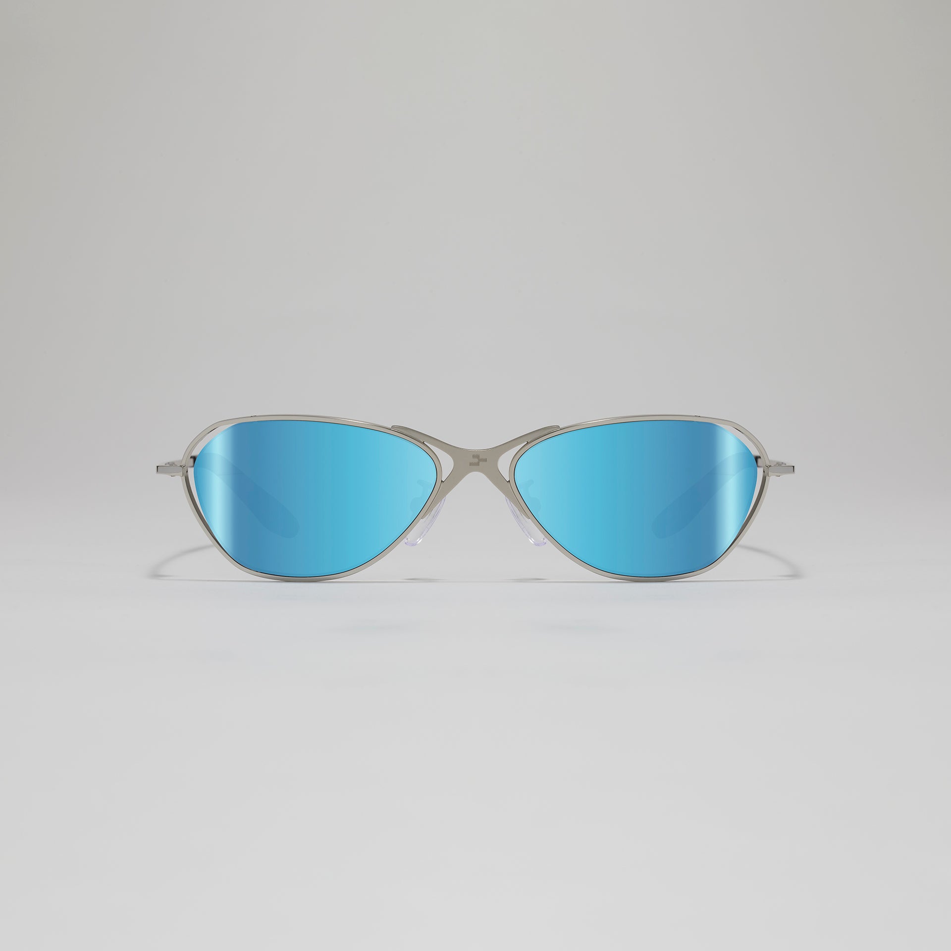 Sunglasses with blue lenses and silver frame on a light gray background