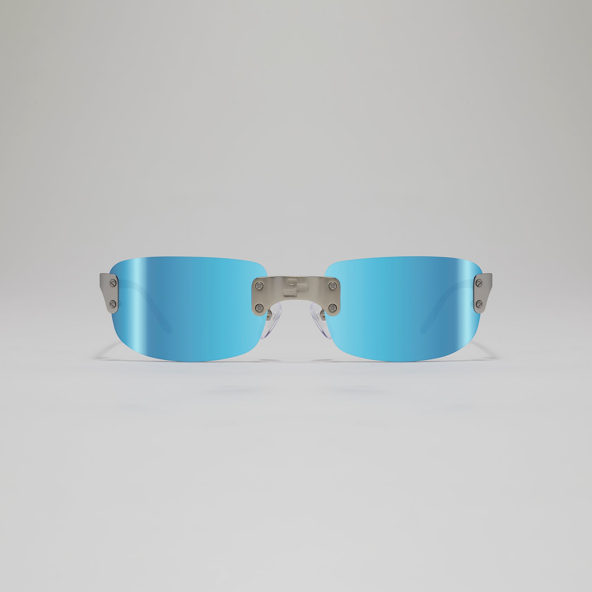 Blue sunglasses with metallic frame on a light gray background