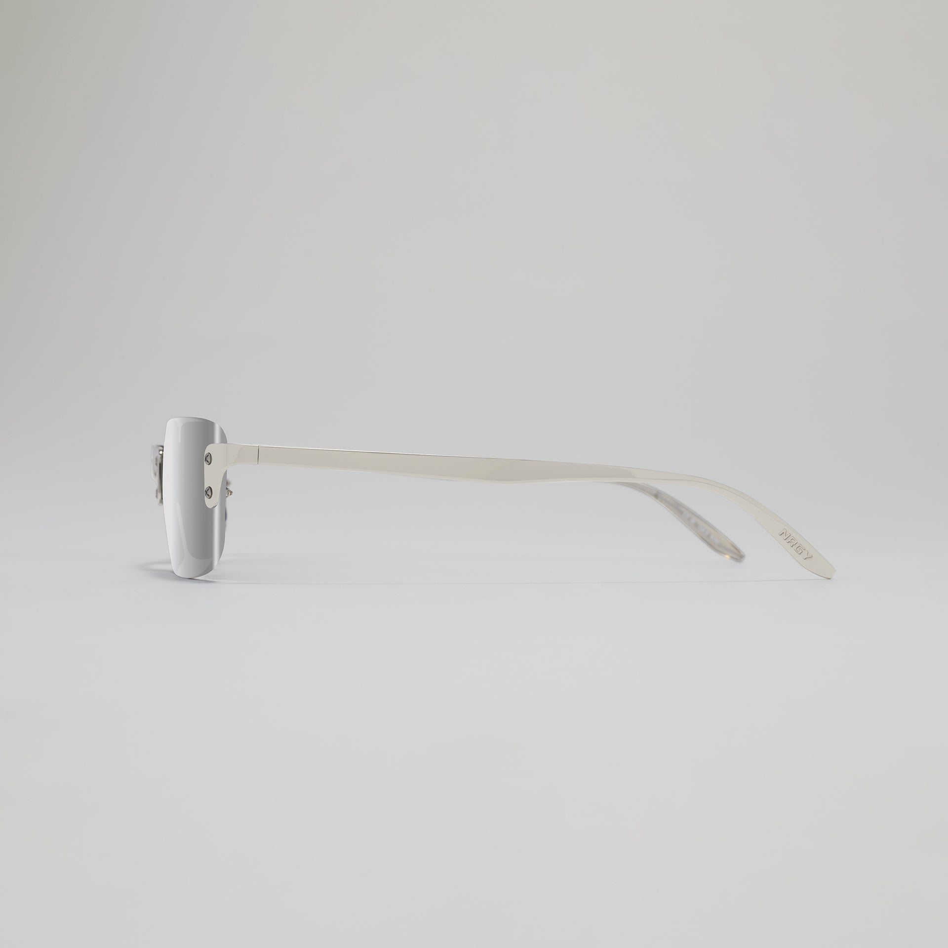 White eyeglasses on a light gray background