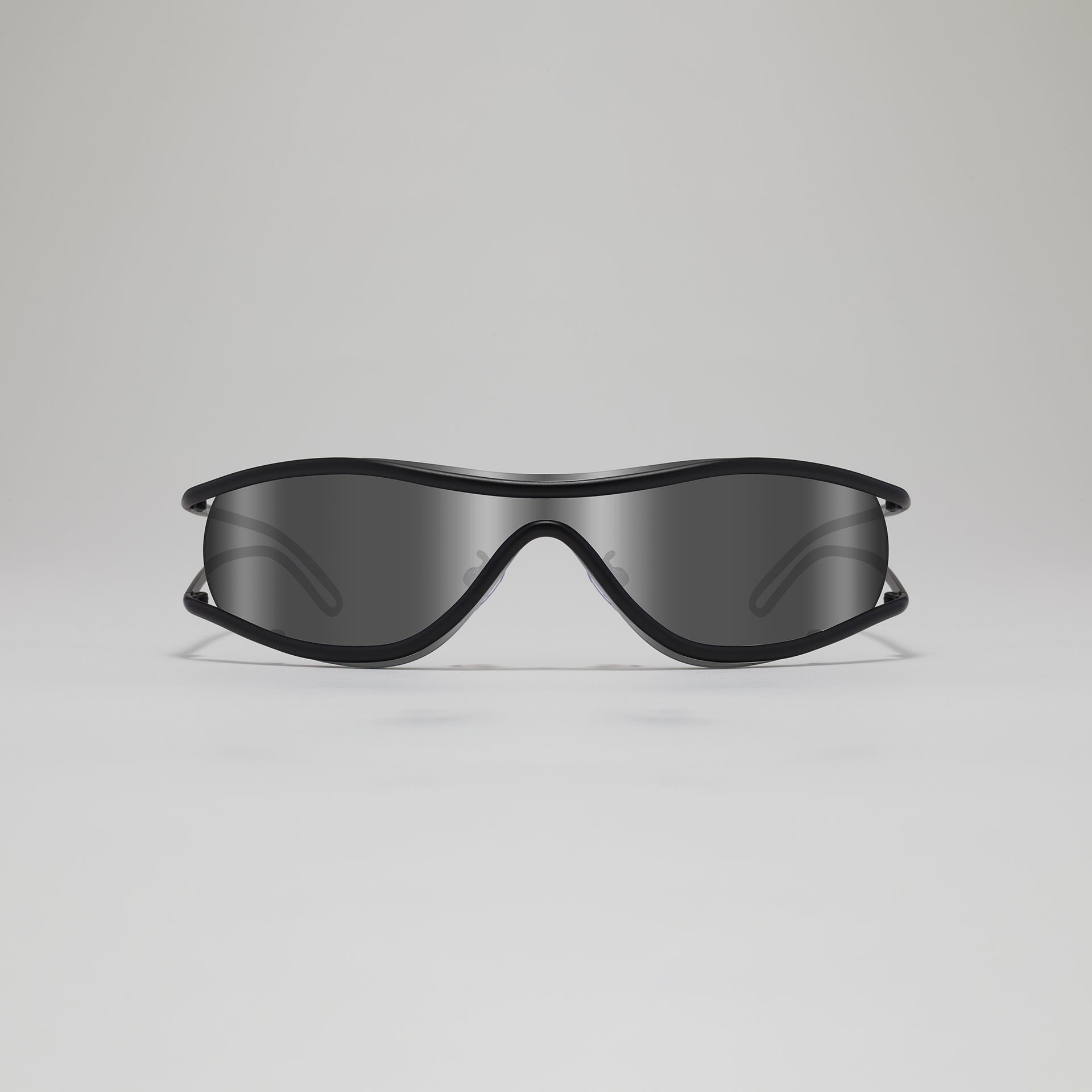 Black sunglasses on a light gray background