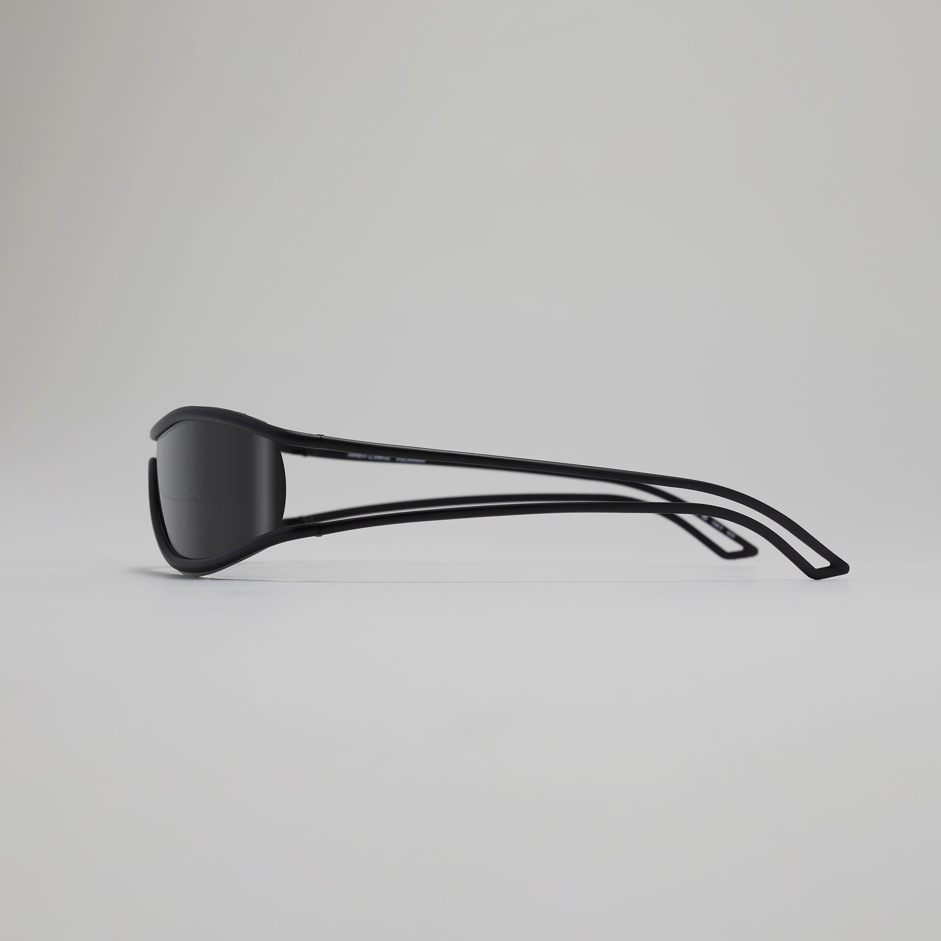 Black sunglasses on a light gray background