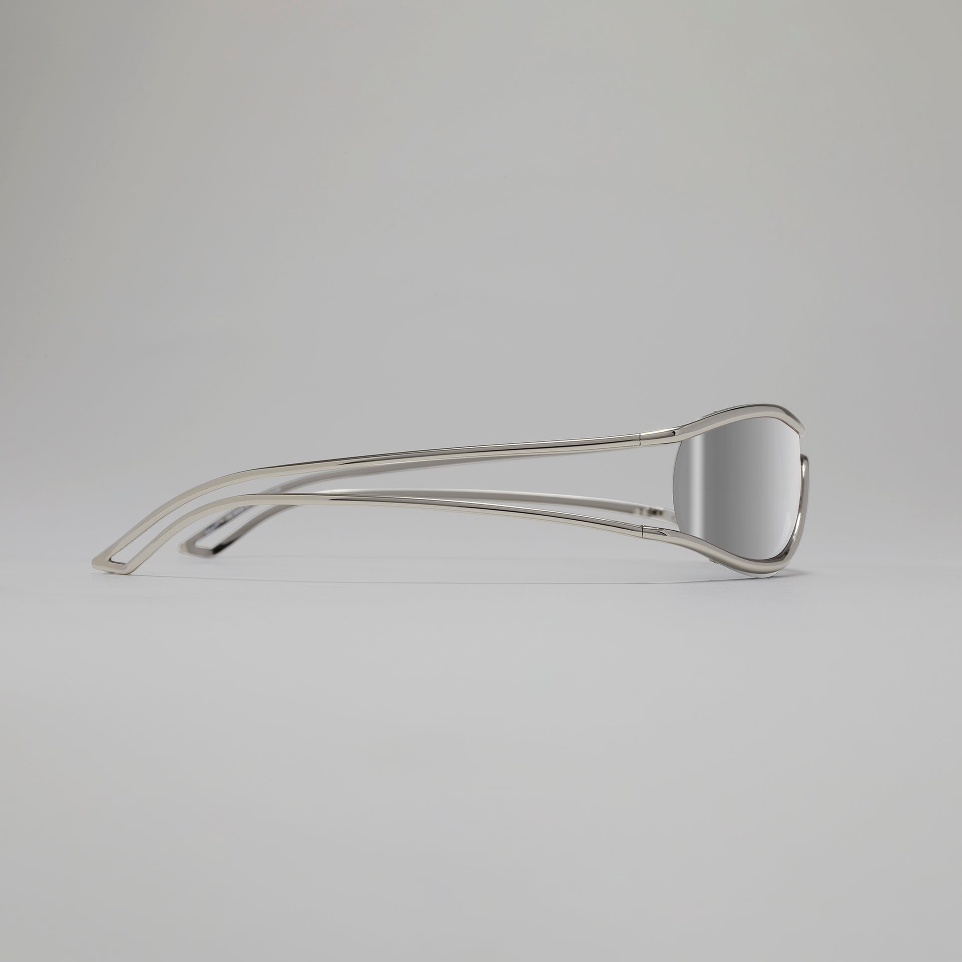 Metallic hair clip on a gray background