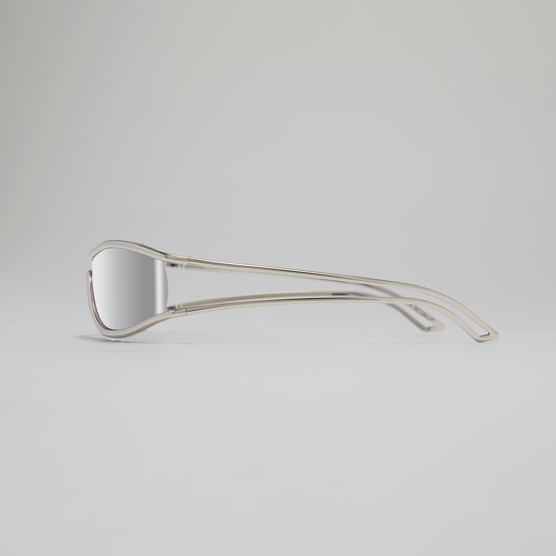 Clear sunglasses with thin frame on a light gray background