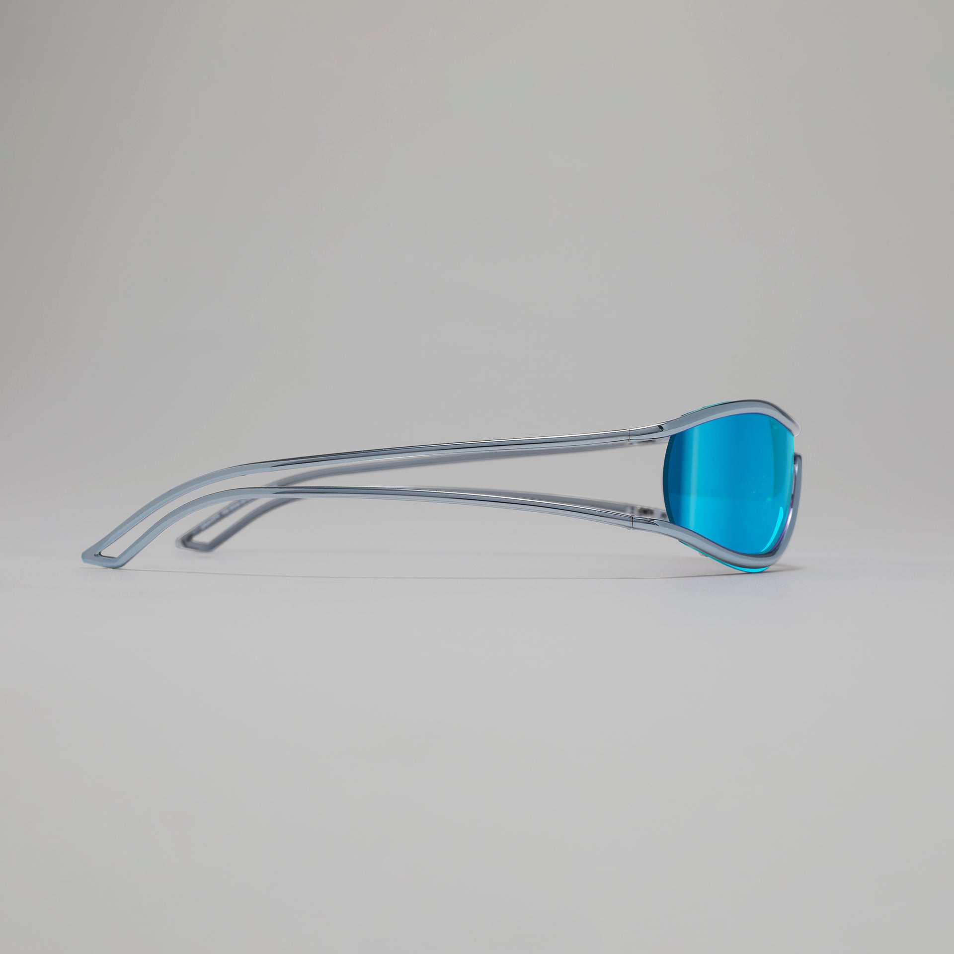 Blue sunglasses with clear frame on a gray background