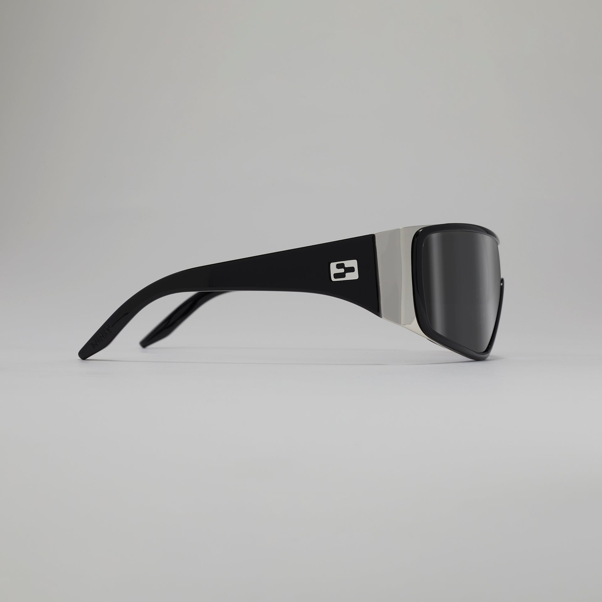 Black and gray sunglasses on a light gray background