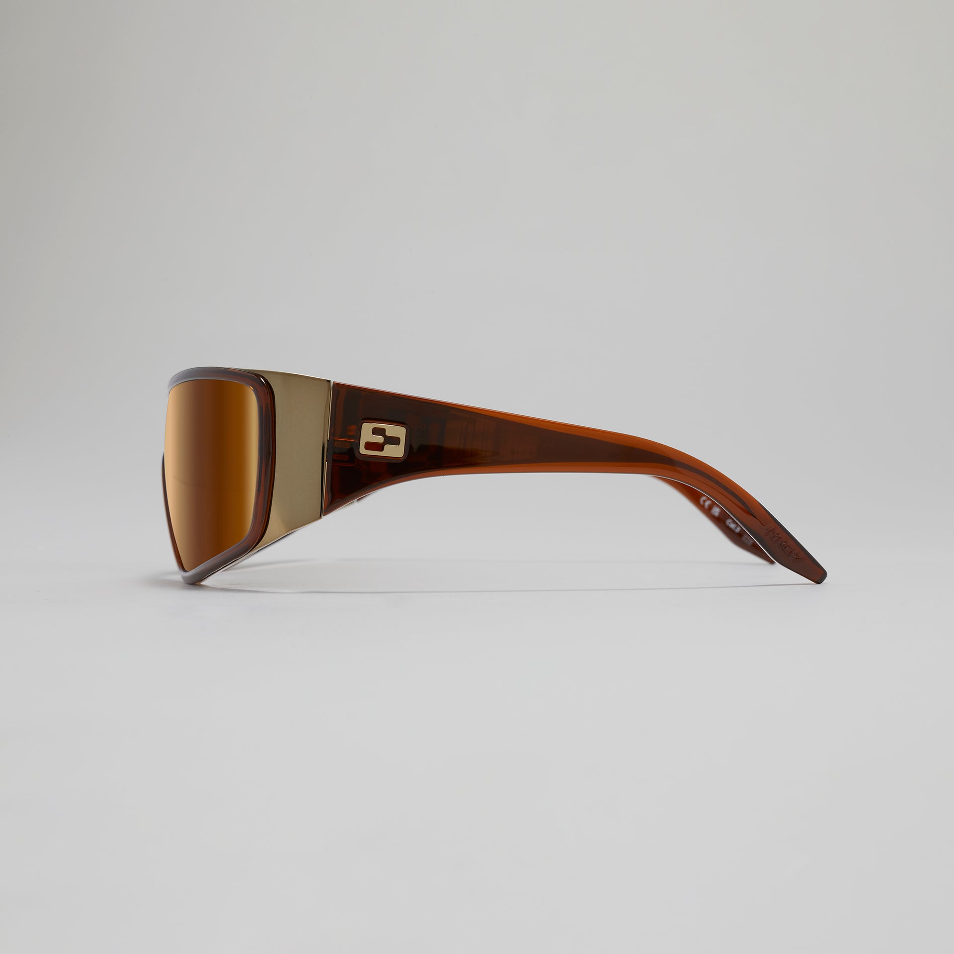 Sunglasses with brown frame and lens on a light gray background