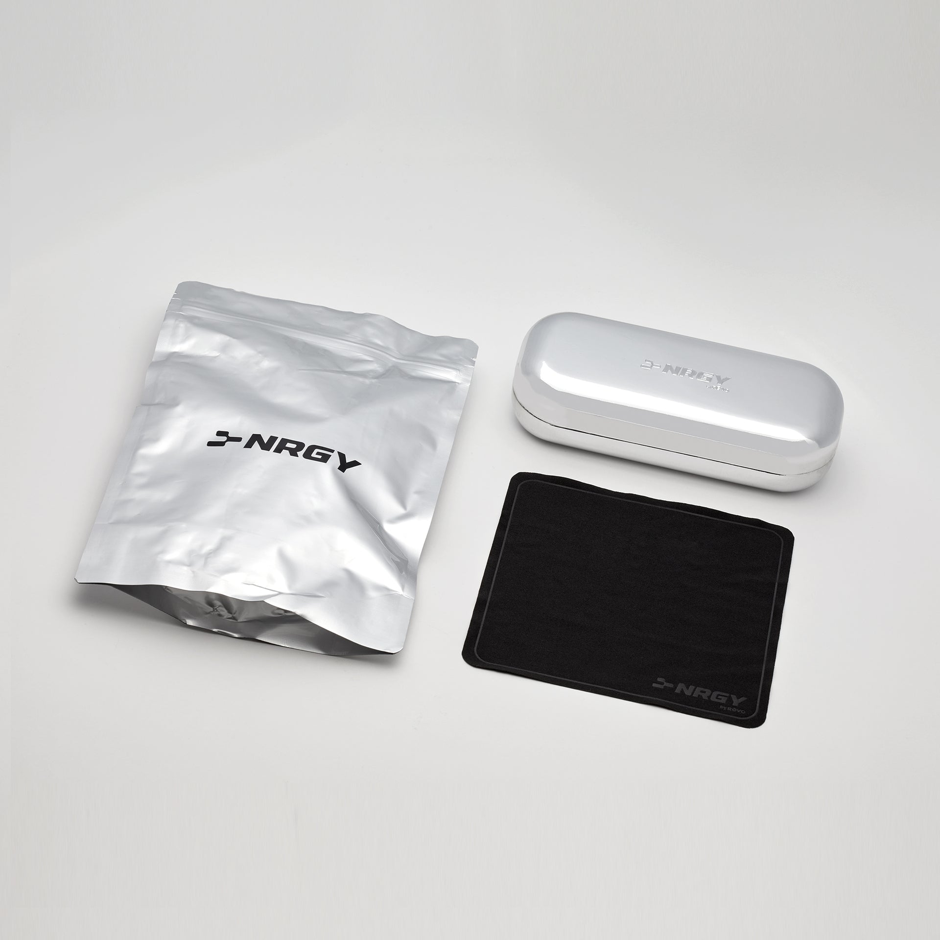 NRGY branded items including a pouch, case, and mat on a light gray background
