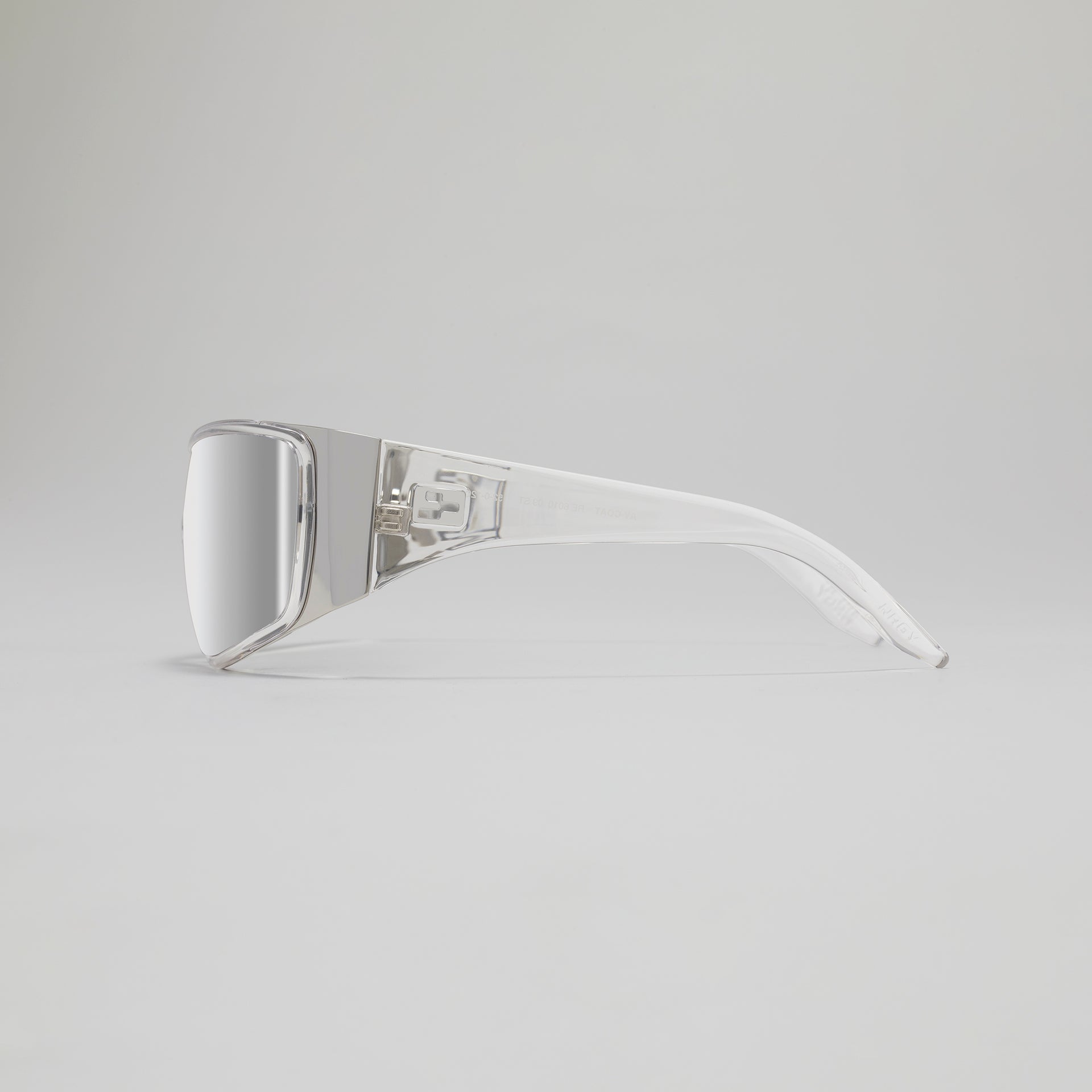 Silver sunglasses on a light gray background