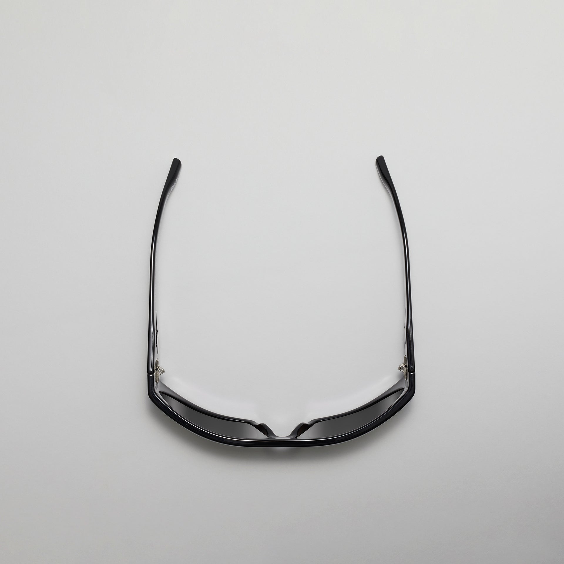 Black eyeglasses on a light gray background
