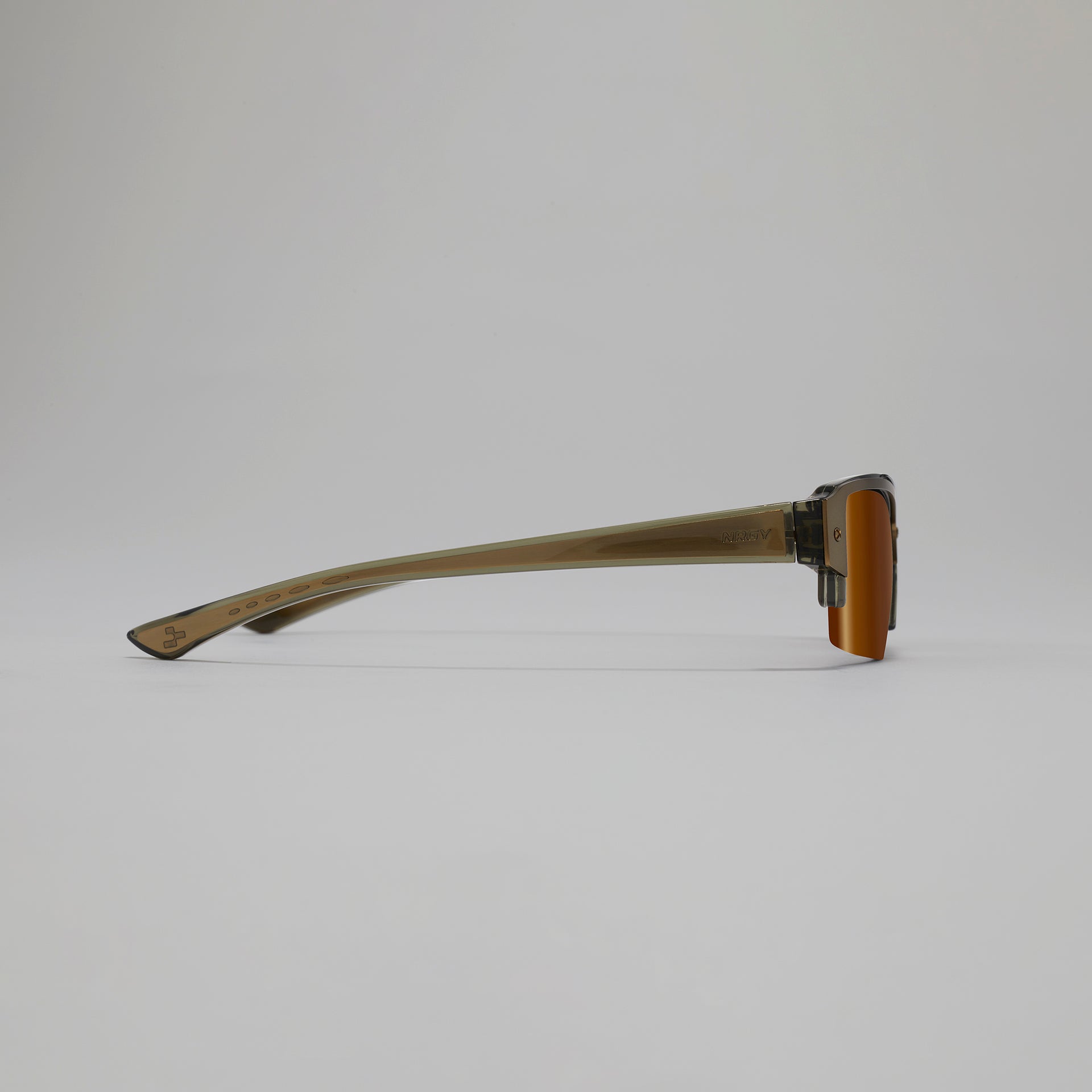 Sunglasses with a gold frame and dark lenses on a light gray background