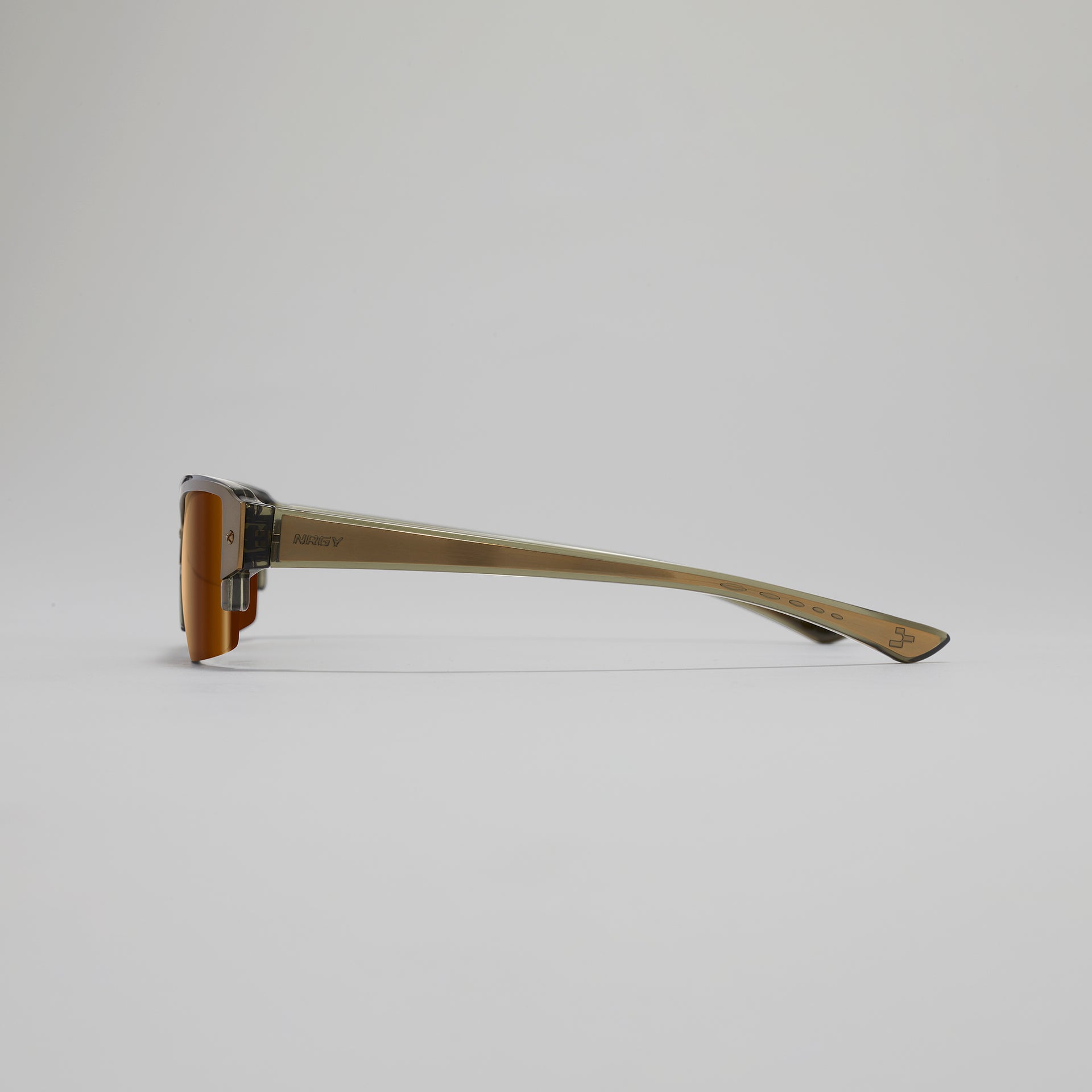 Sunglasses with a gold frame on a light gray background