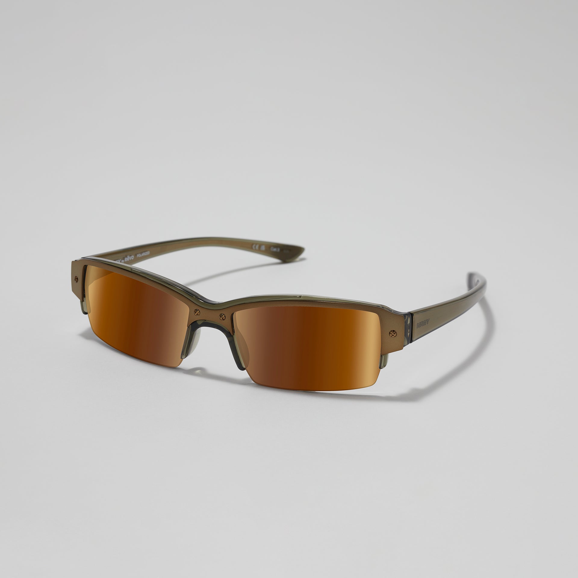 Sunglasses with brown lenses and gold frame on a light gray background