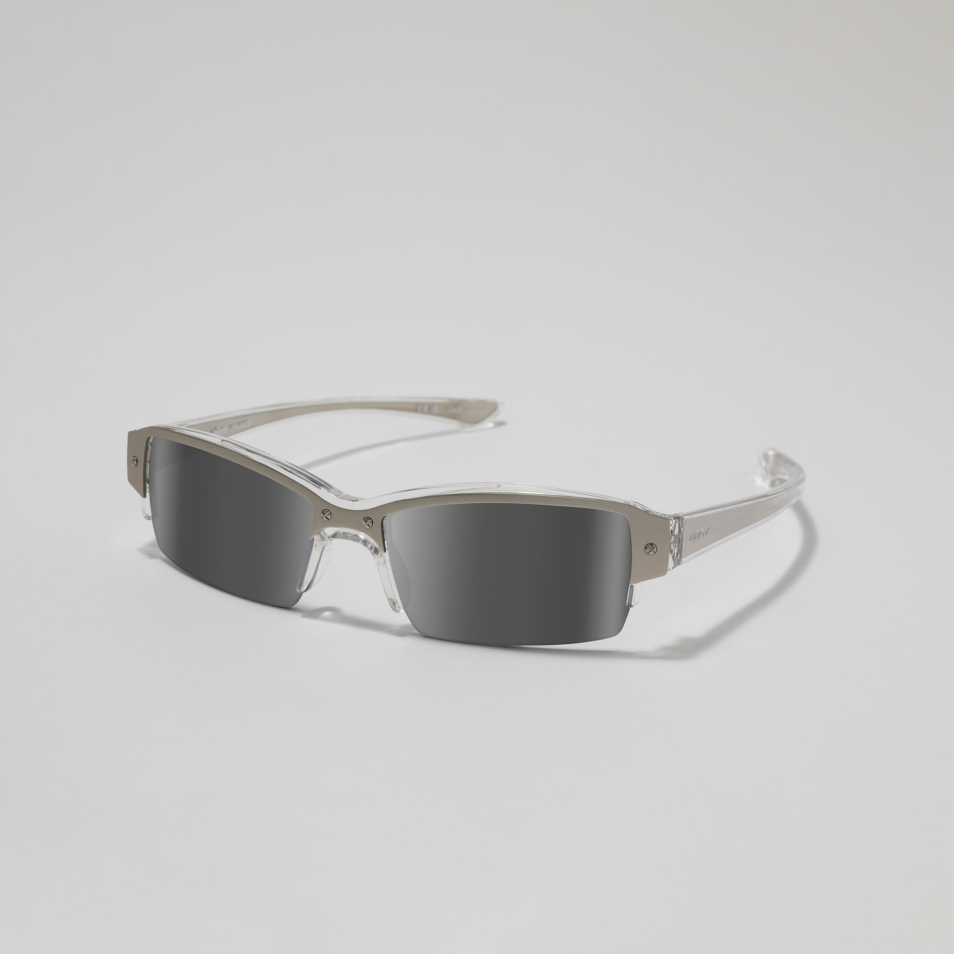 Sunglasses with reflective lenses on a light gray background
