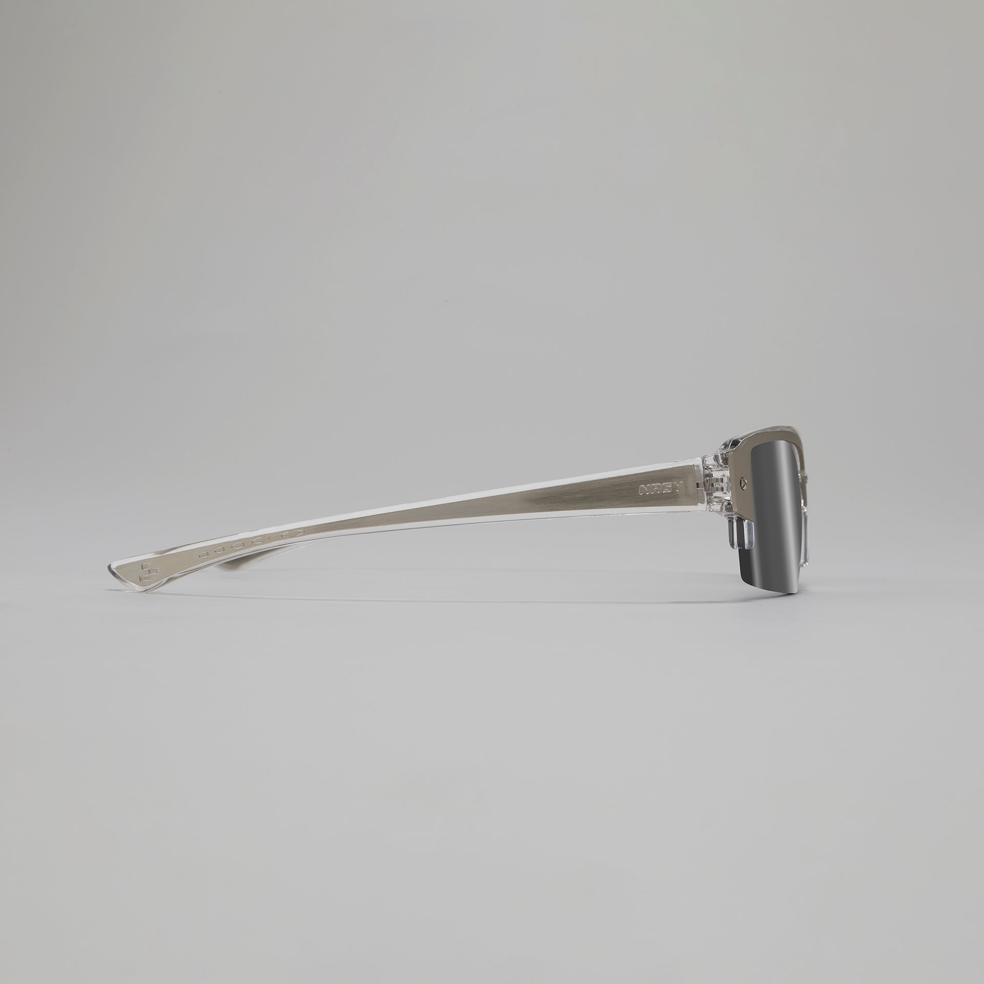 Silver sunglasses on a light gray background