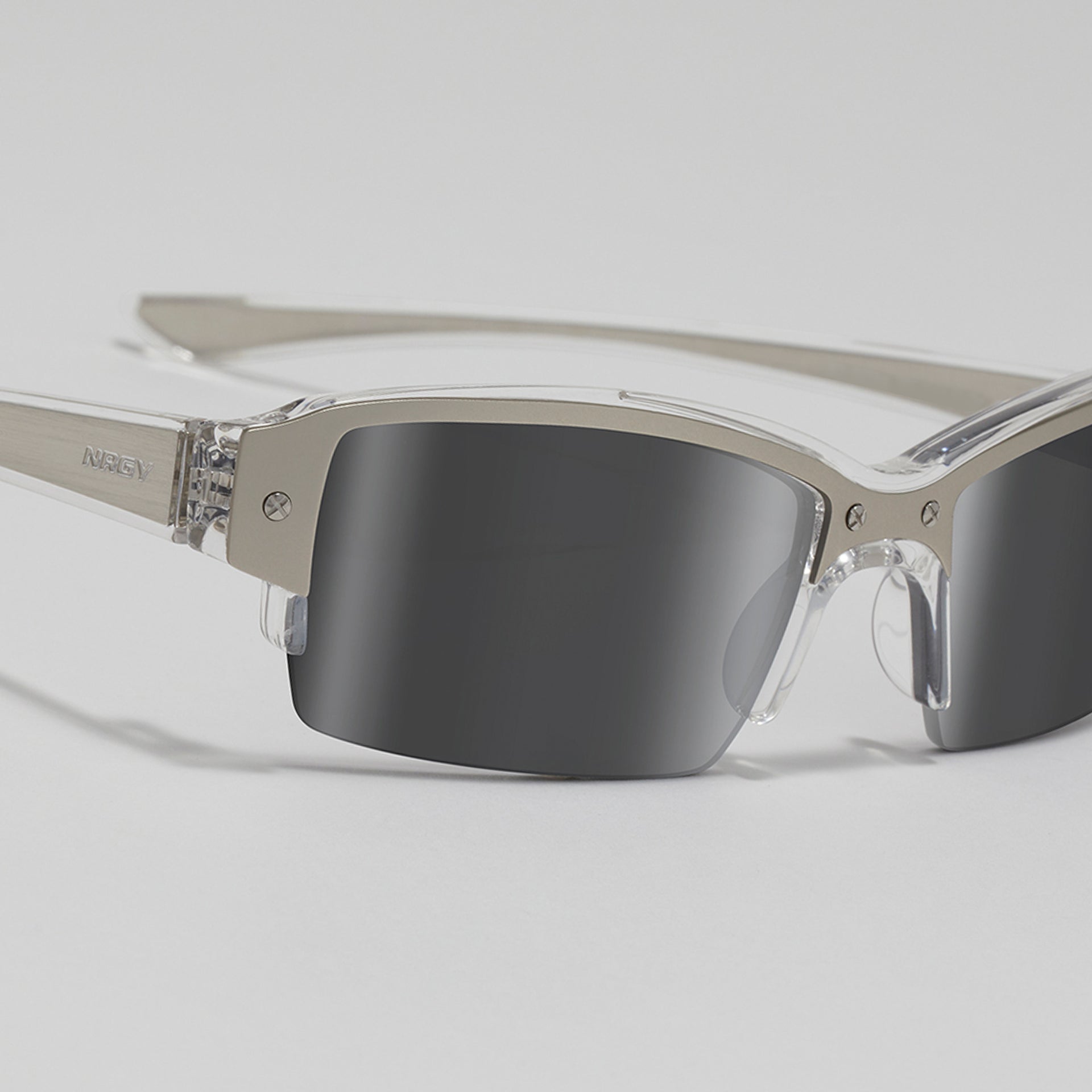Sunglasses with reflective lenses on a light gray background