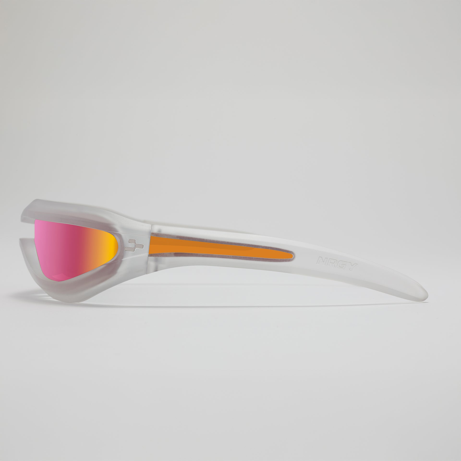 Sunglasses with pink lenses and clear frame on a light gray background