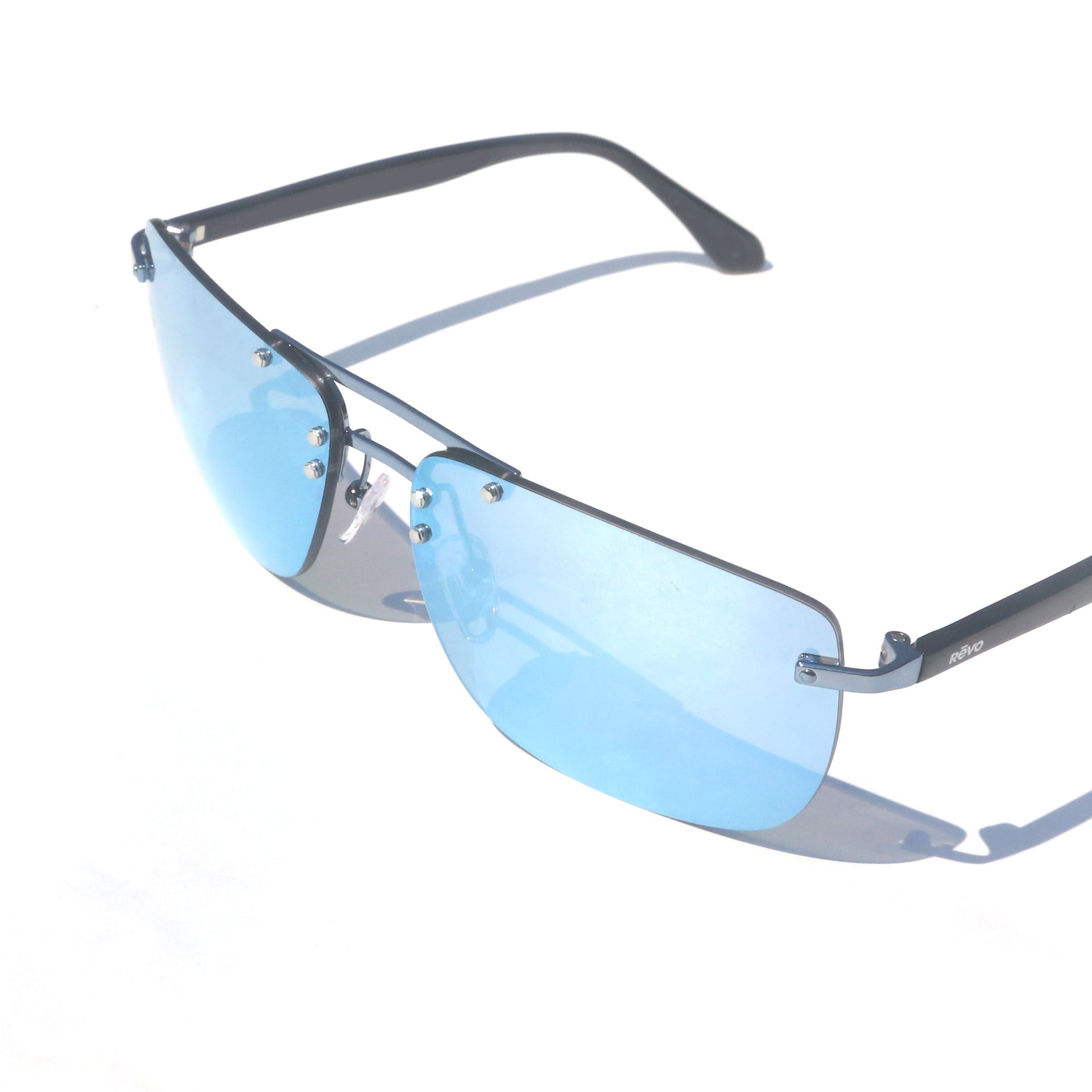 Sunglasses with blue lenses and silver frame on a white background