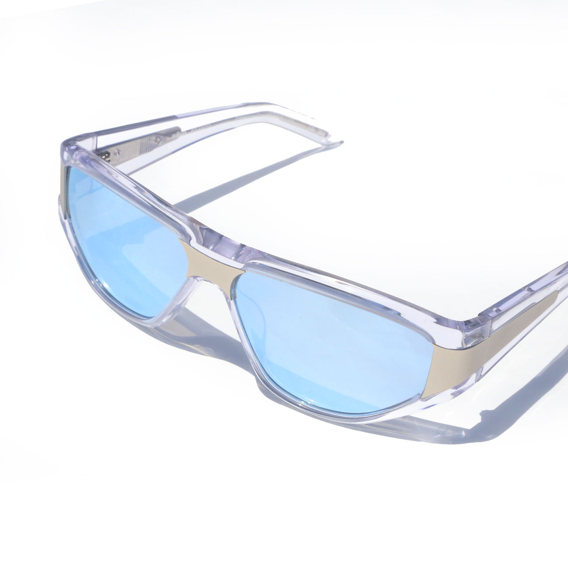 Clear frame sunglasses with blue lenses on a white background