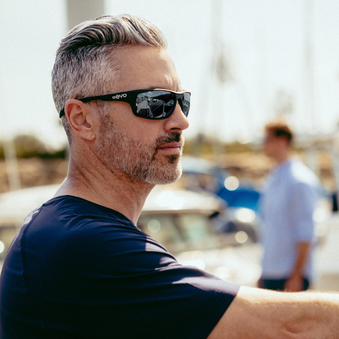 Man wearing sunglasses with a blurred background