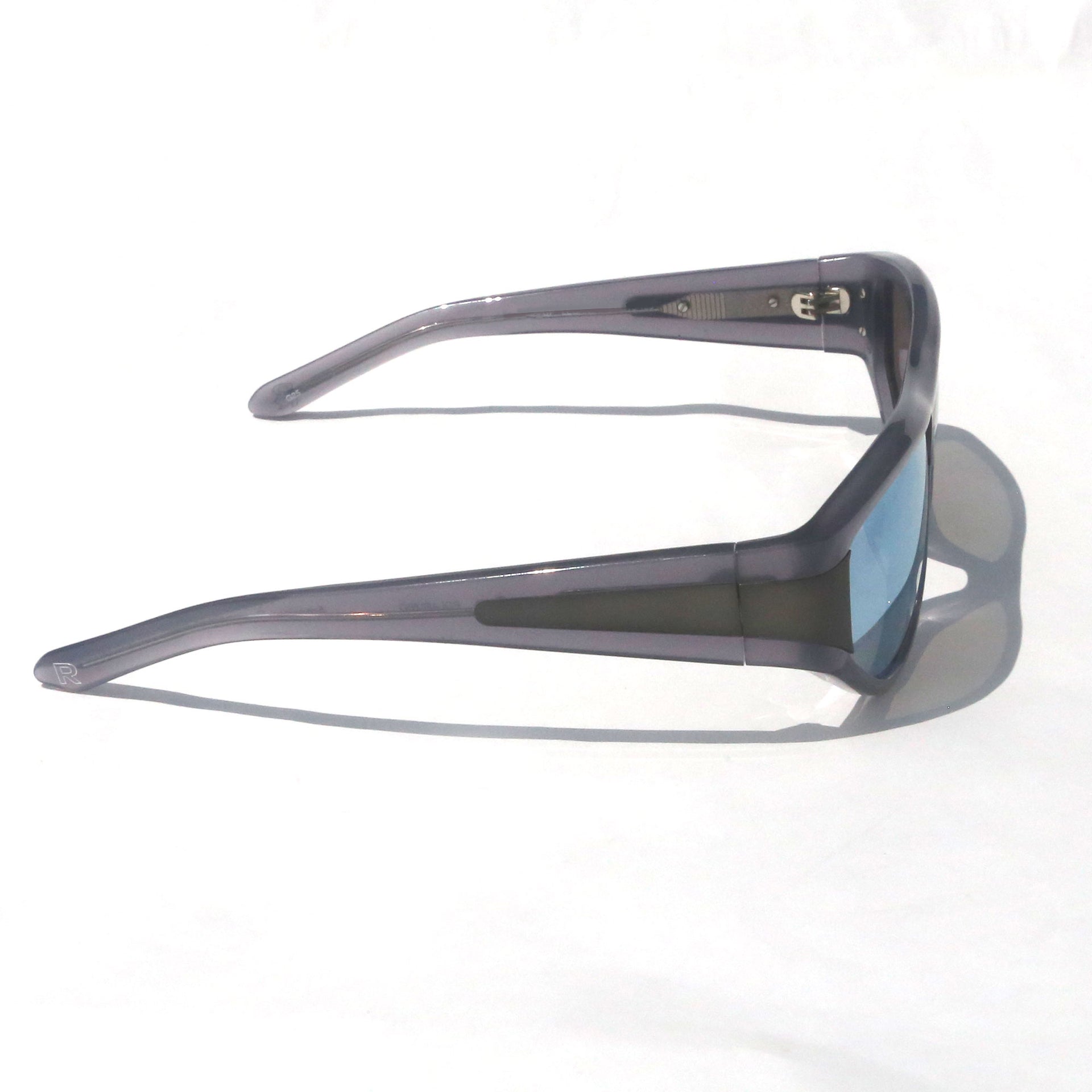 Sunglasses with a gray frame and blue lenses on a white background