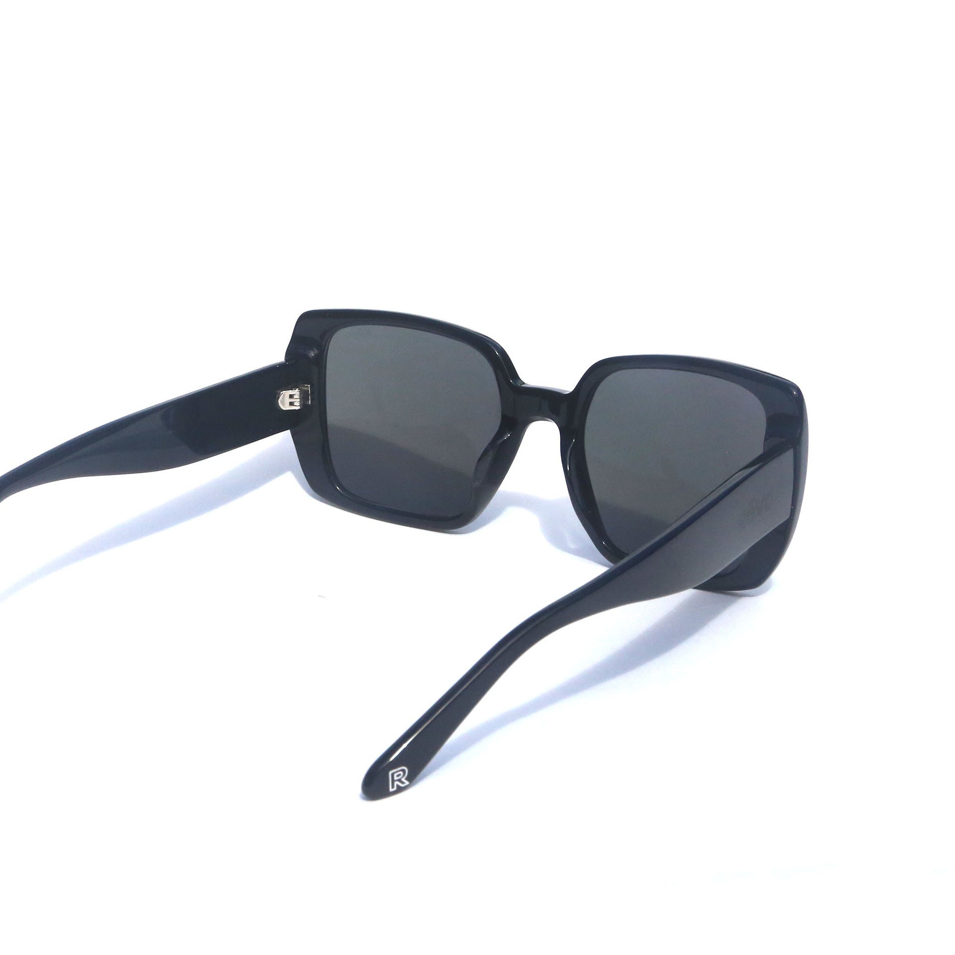 Black sunglasses with dark lenses on a white background