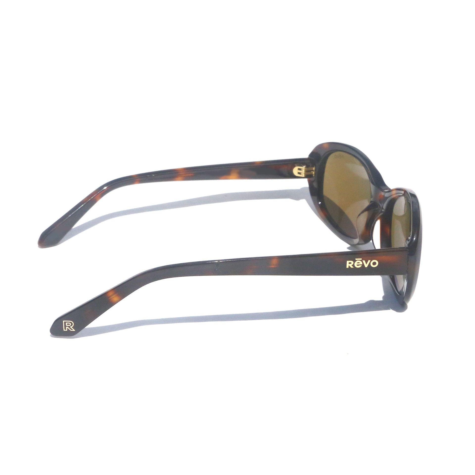 Sunglasses with tortoiseshell frame and gold accents on a white background