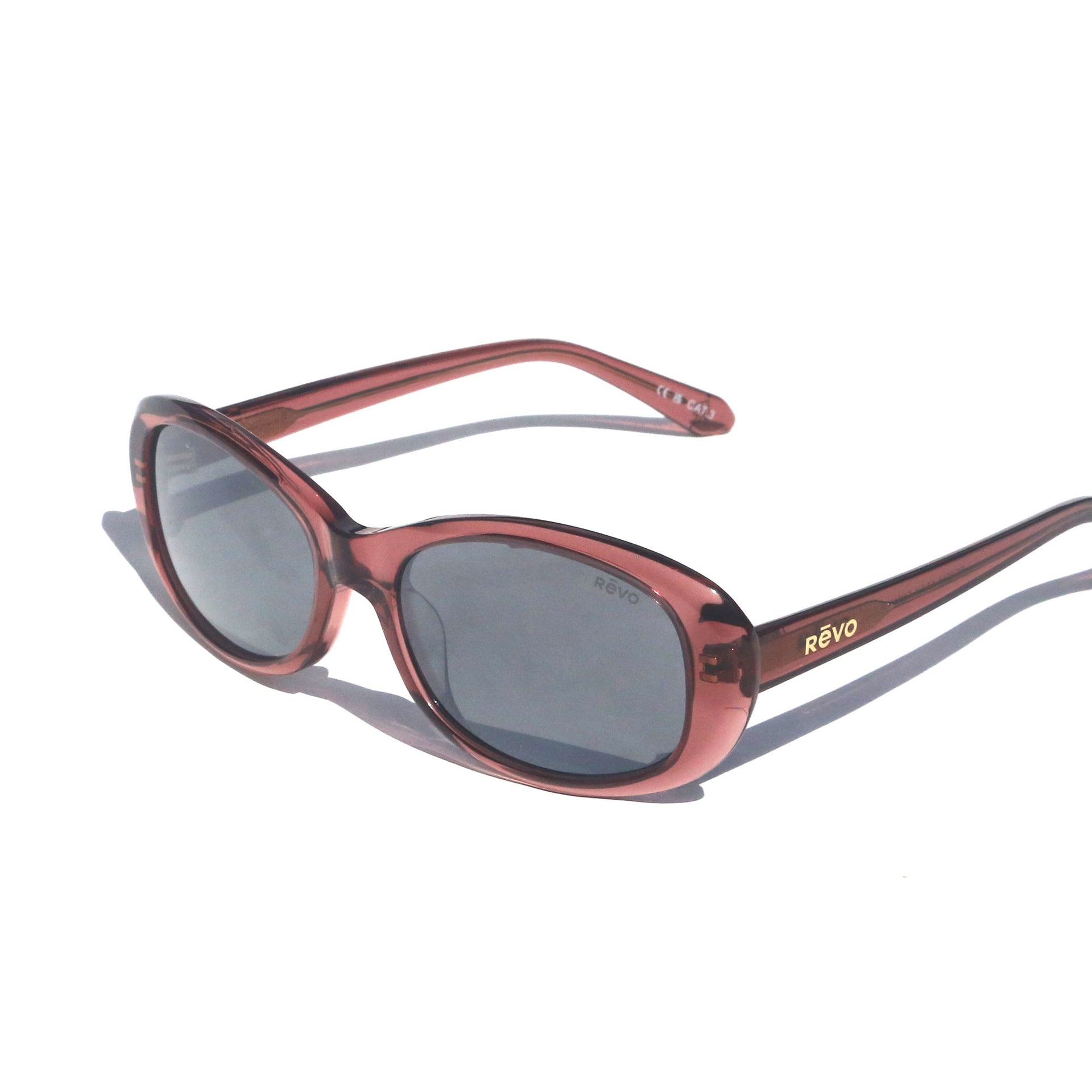 Sunglasses with red frame and dark lenses on a white background