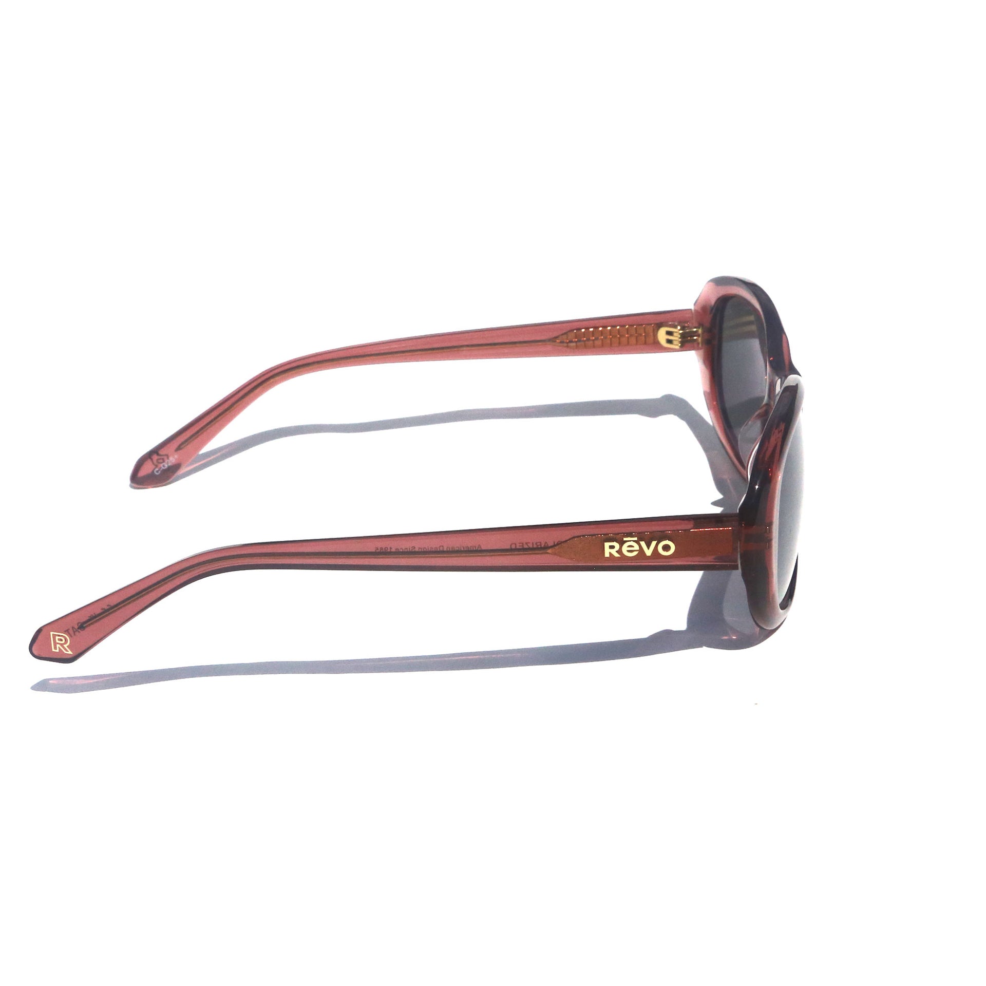 Sunglasses with red frame and 'REVO' logo on a white background