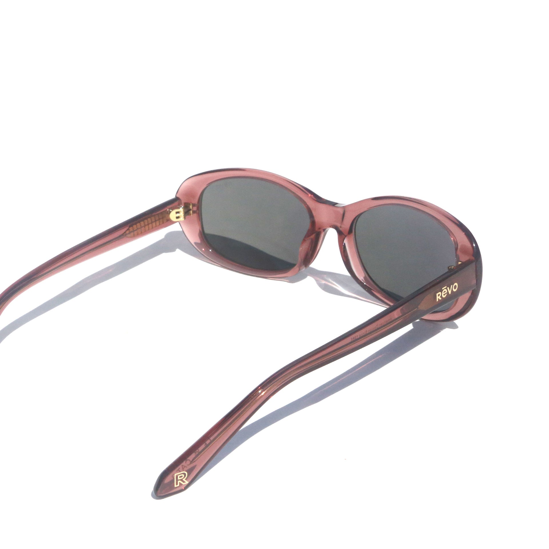 Sunglasses with a pink frame on a white background