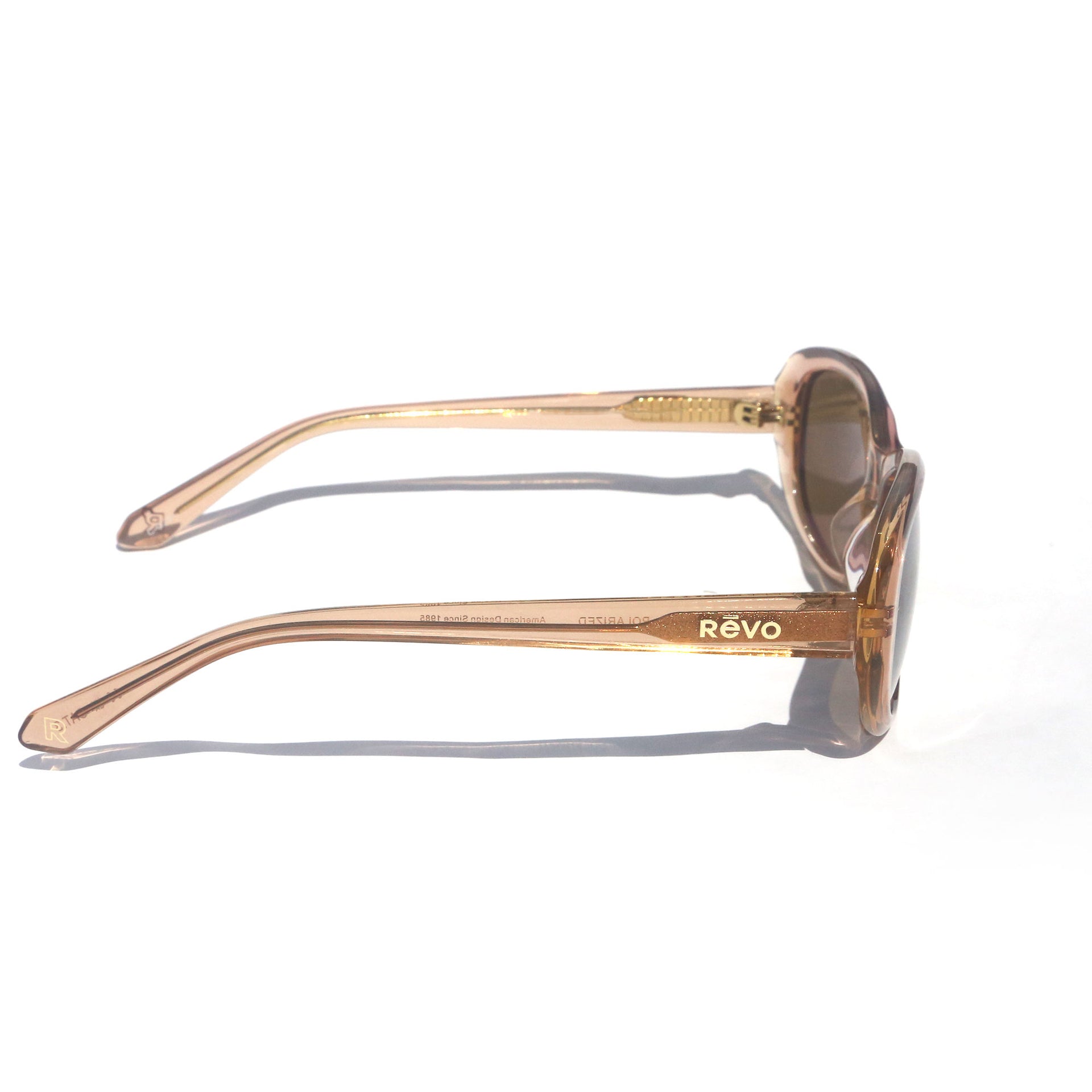 Sunglasses with 'Revo' branding on a white background