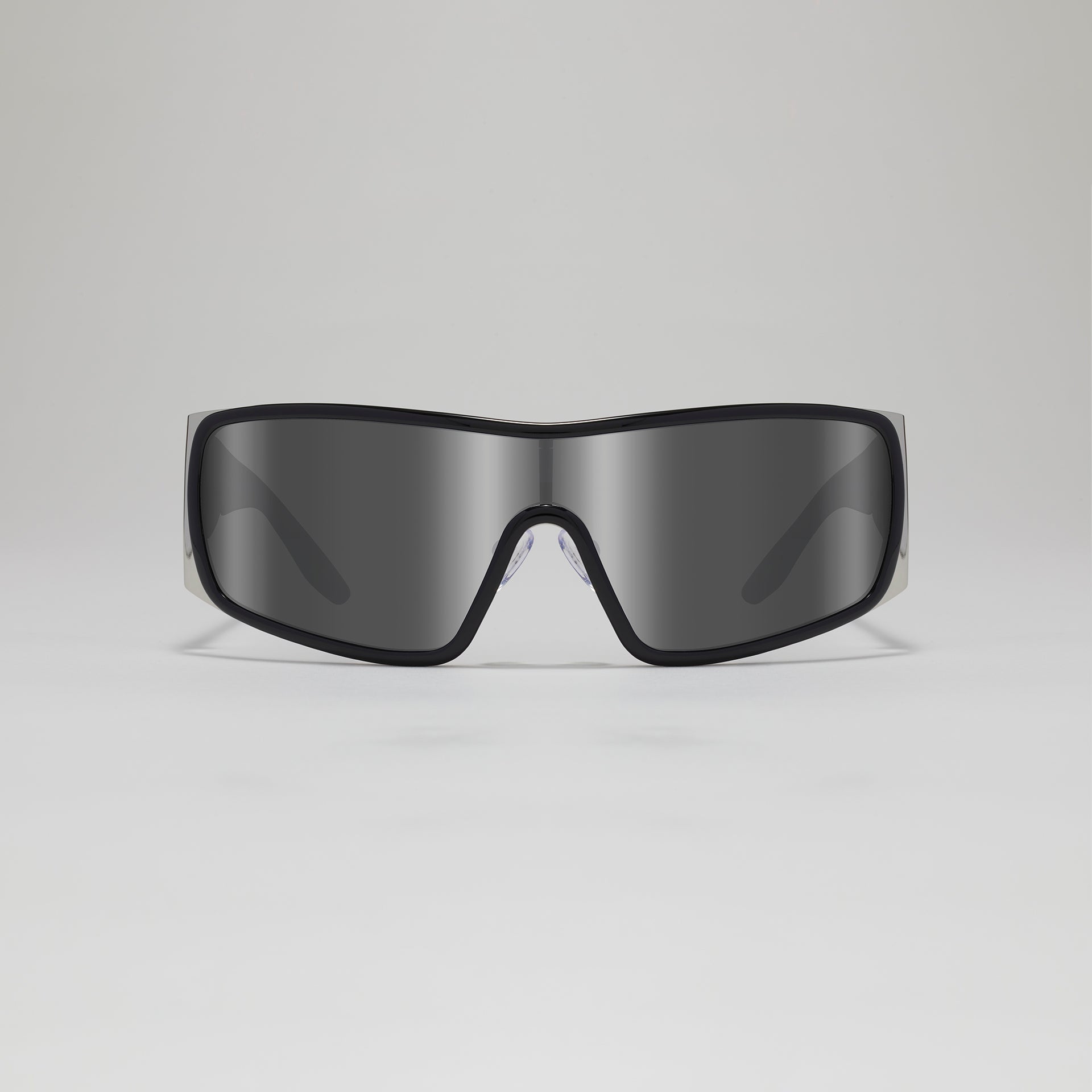 Black sunglasses with reflective lenses on a light gray background