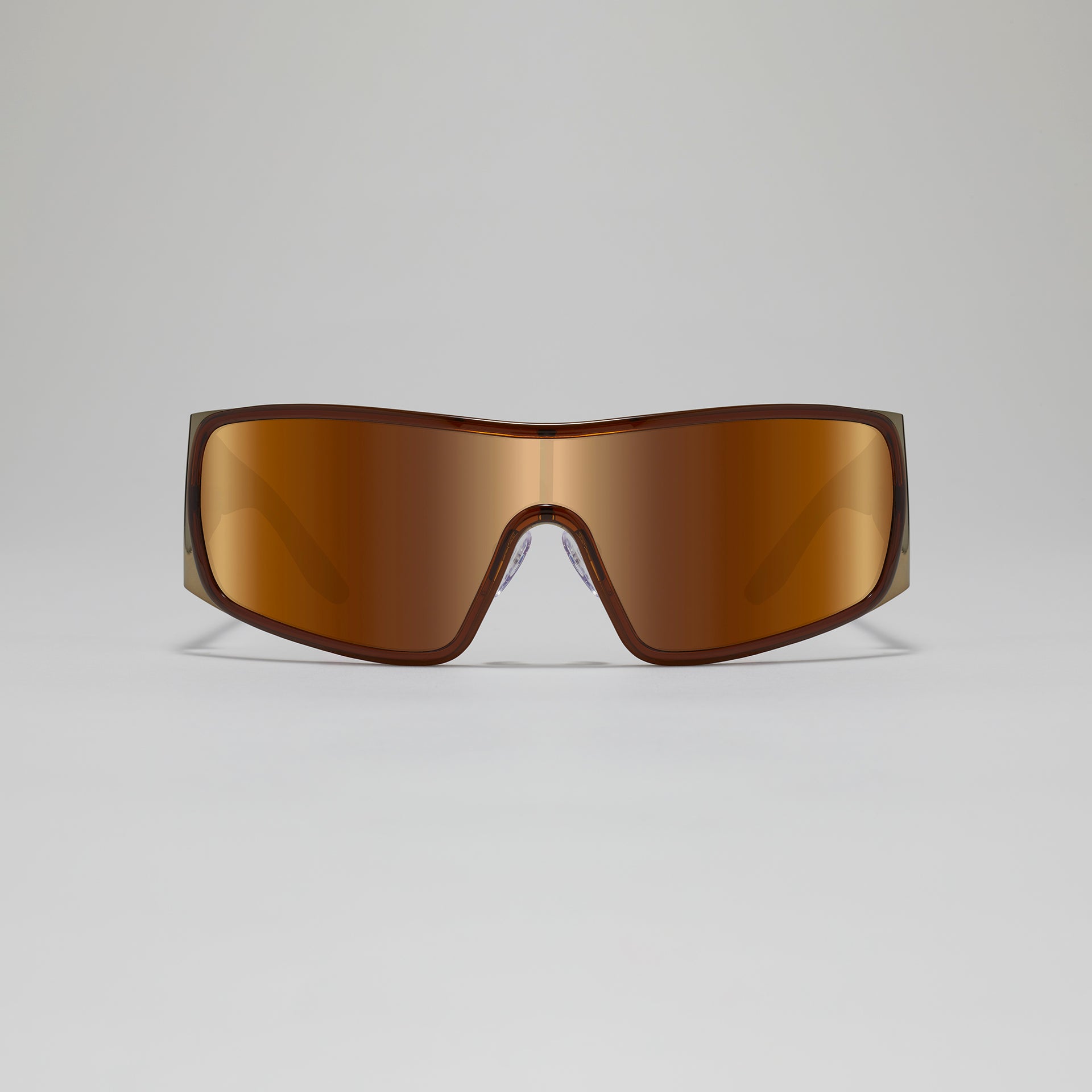 Brown sunglasses on a light gray background