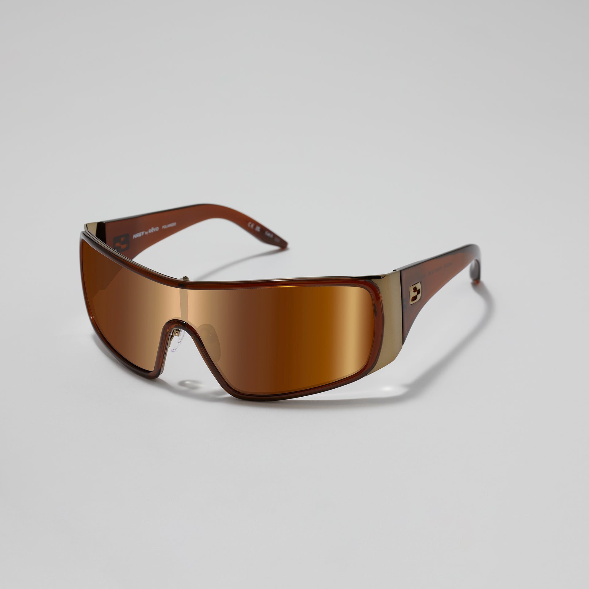 Brown sunglasses with a reflective lens on a light gray background