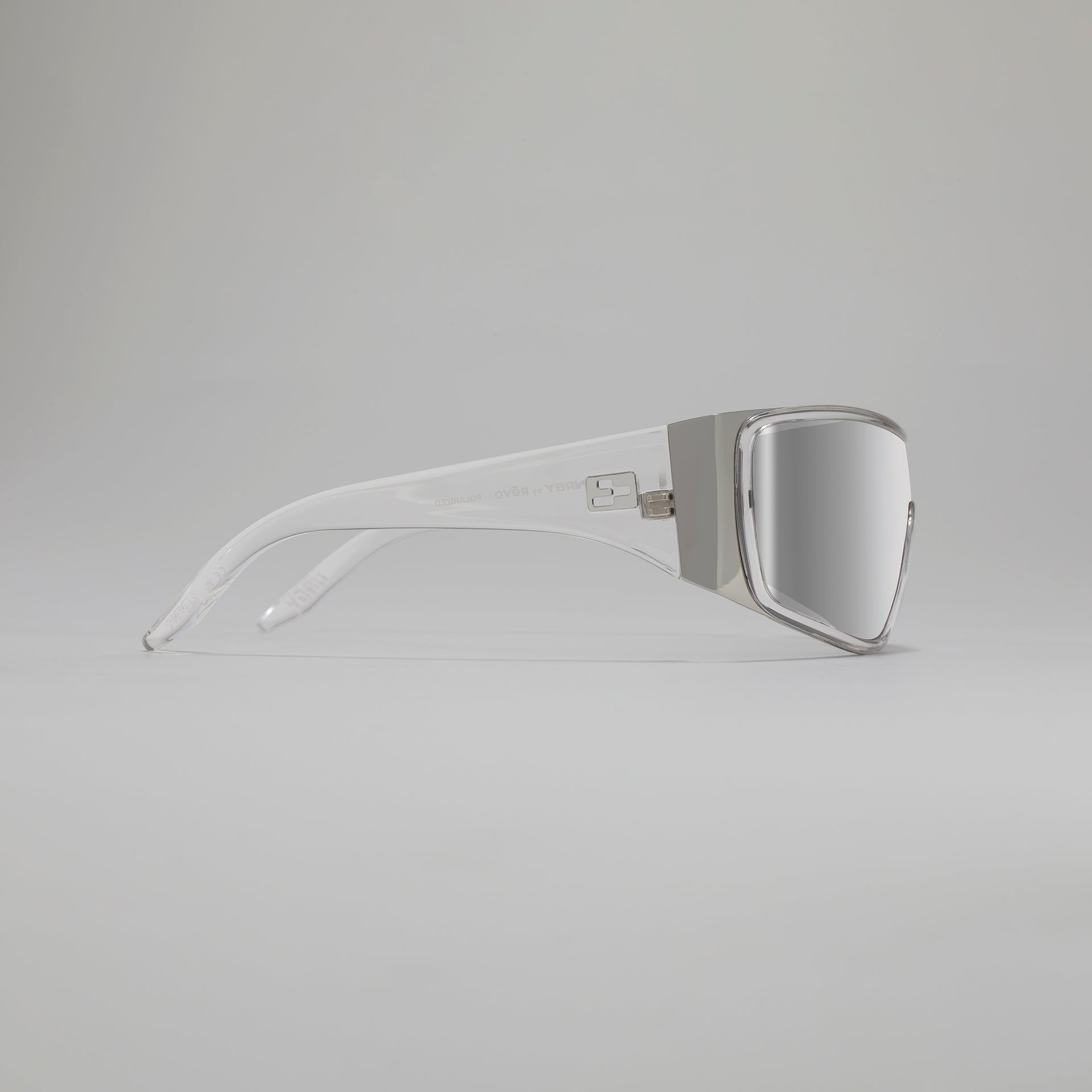 Sunglasses with a reflective lens on a light gray background