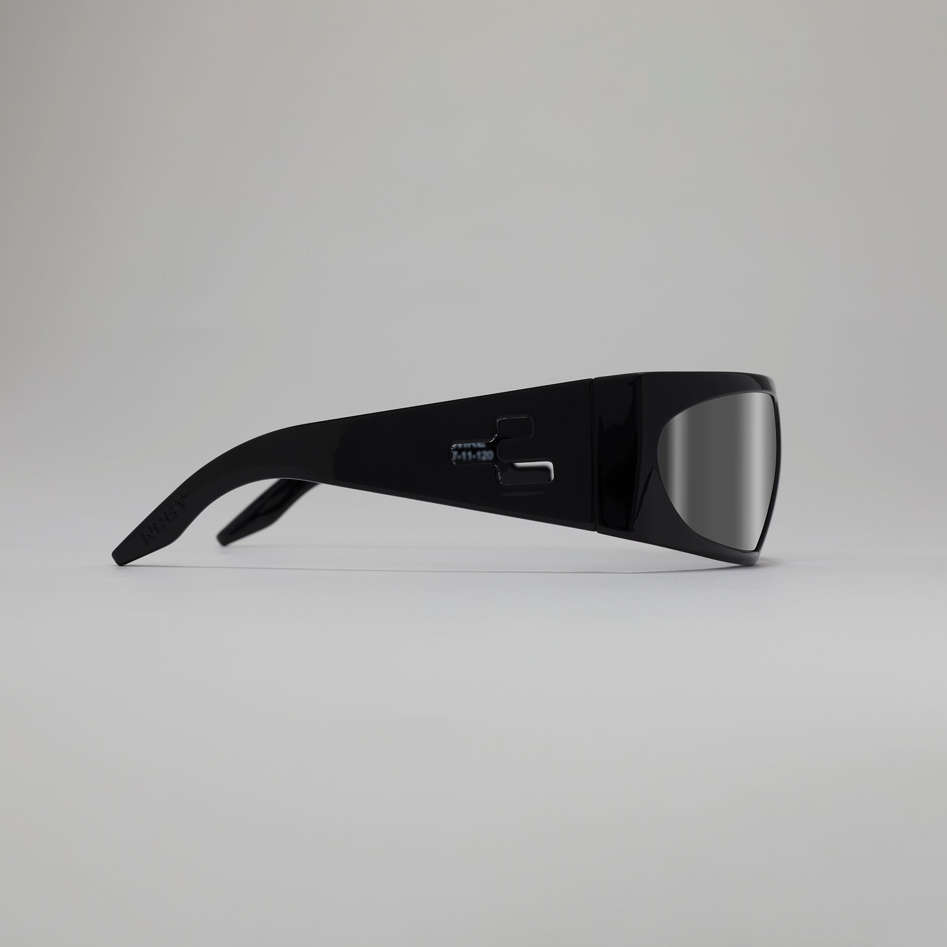 Black sunglasses with reflective lenses on a gray background
