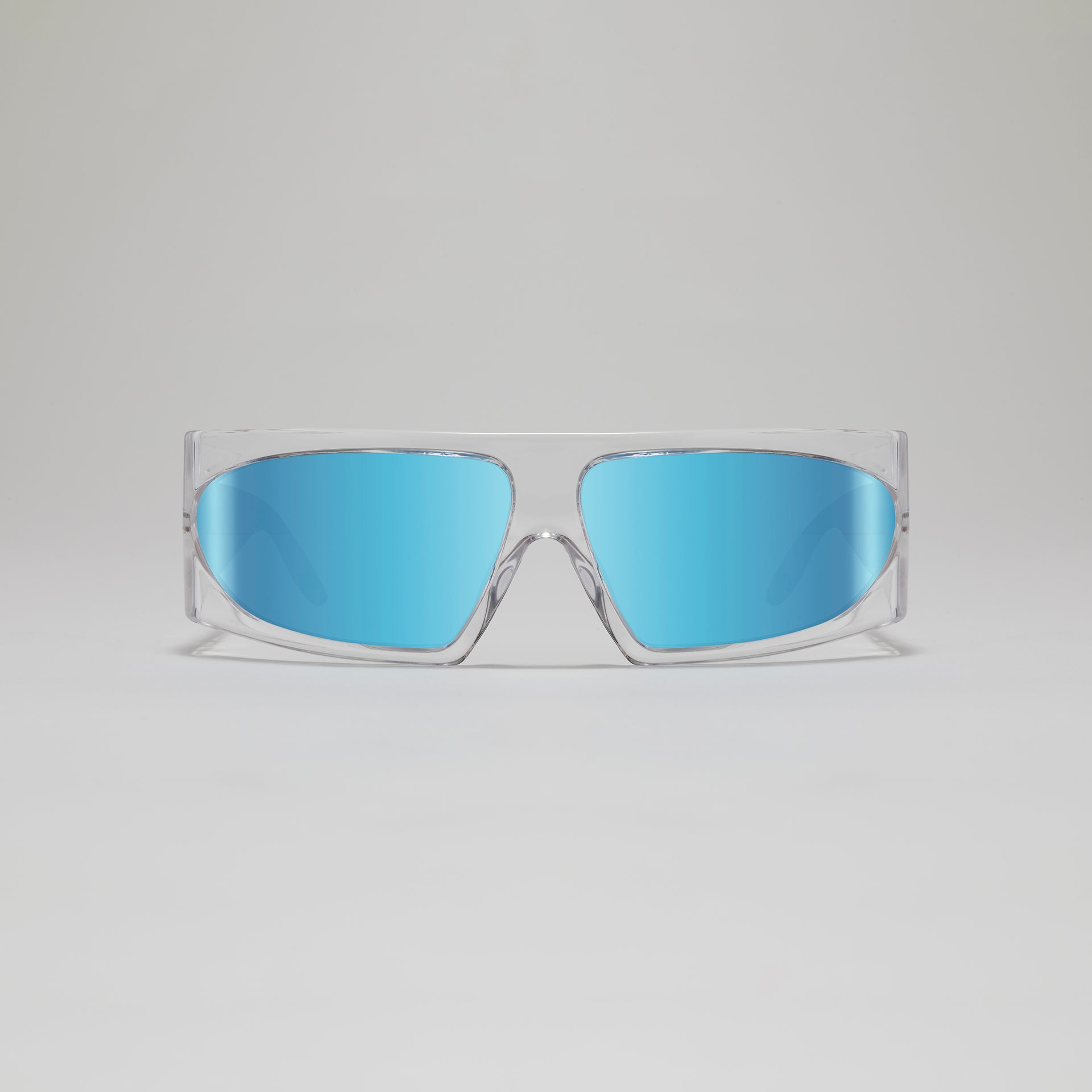 Sunglasses with blue lenses and clear frame on a light gray background