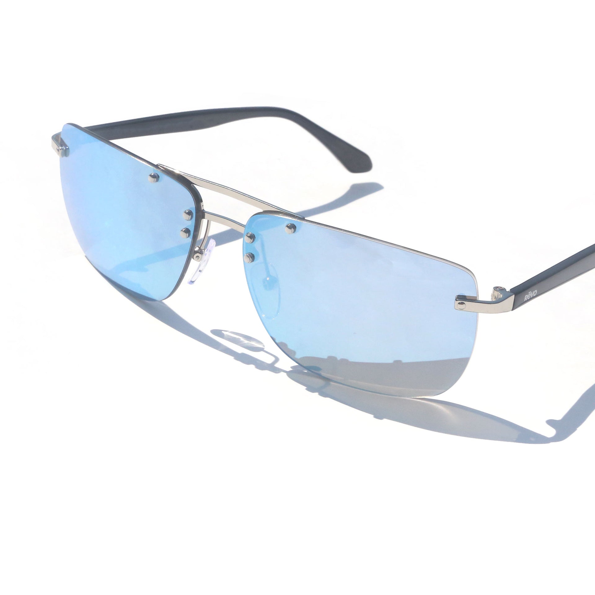 Sunglasses with blue lenses and silver frame on a white background