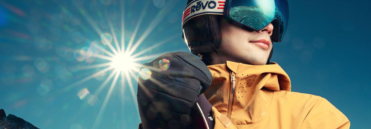 Skier in Revo goggles with the sun behind them